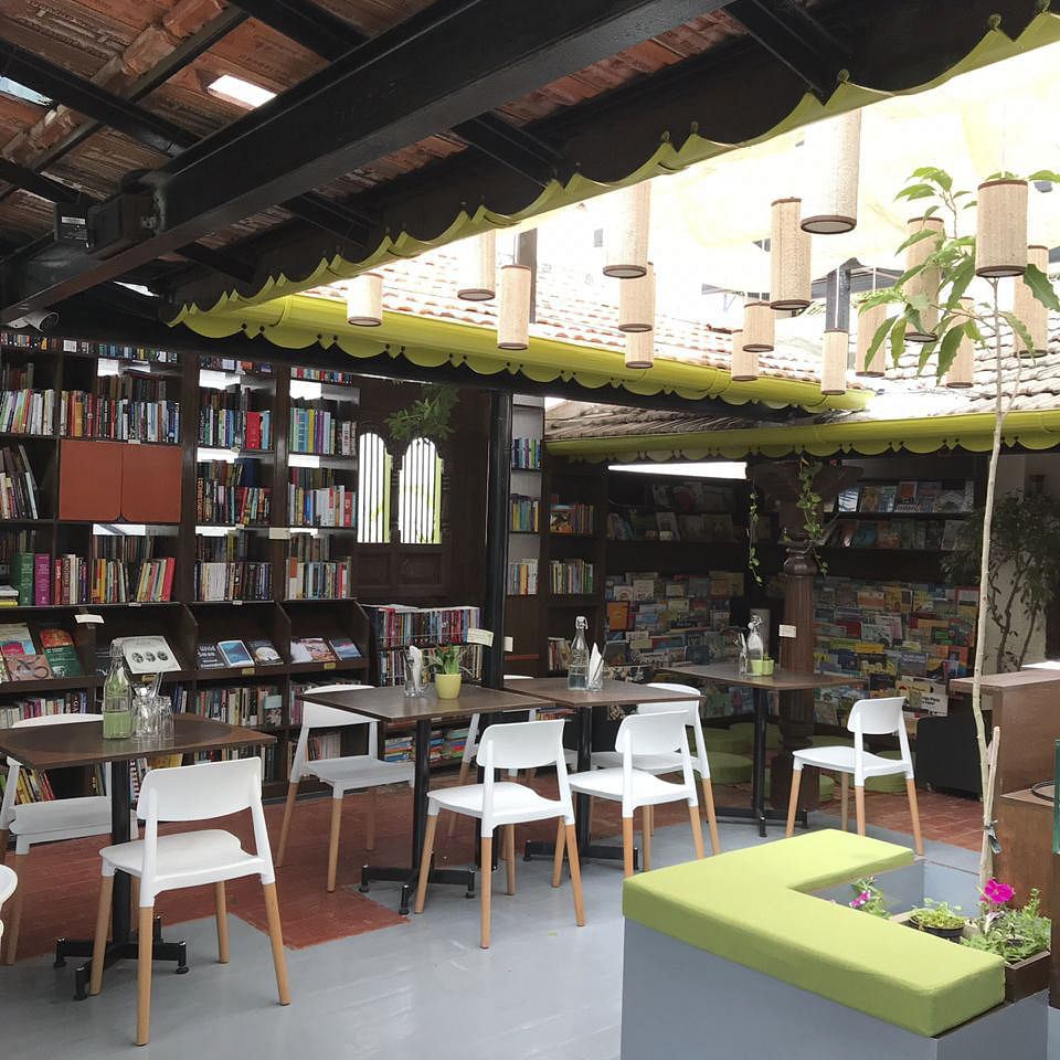 Building,Room,Interior design,Furniture,Restaurant,Bookselling,Table,Architecture,Coffeehouse,Café