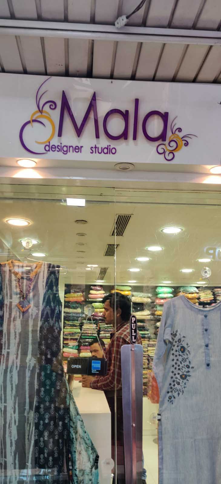 Outlet store,Boutique,Building,Retail,Textile,Interior design,Shopping mall,Shopping,Fashion accessory,Shoe
