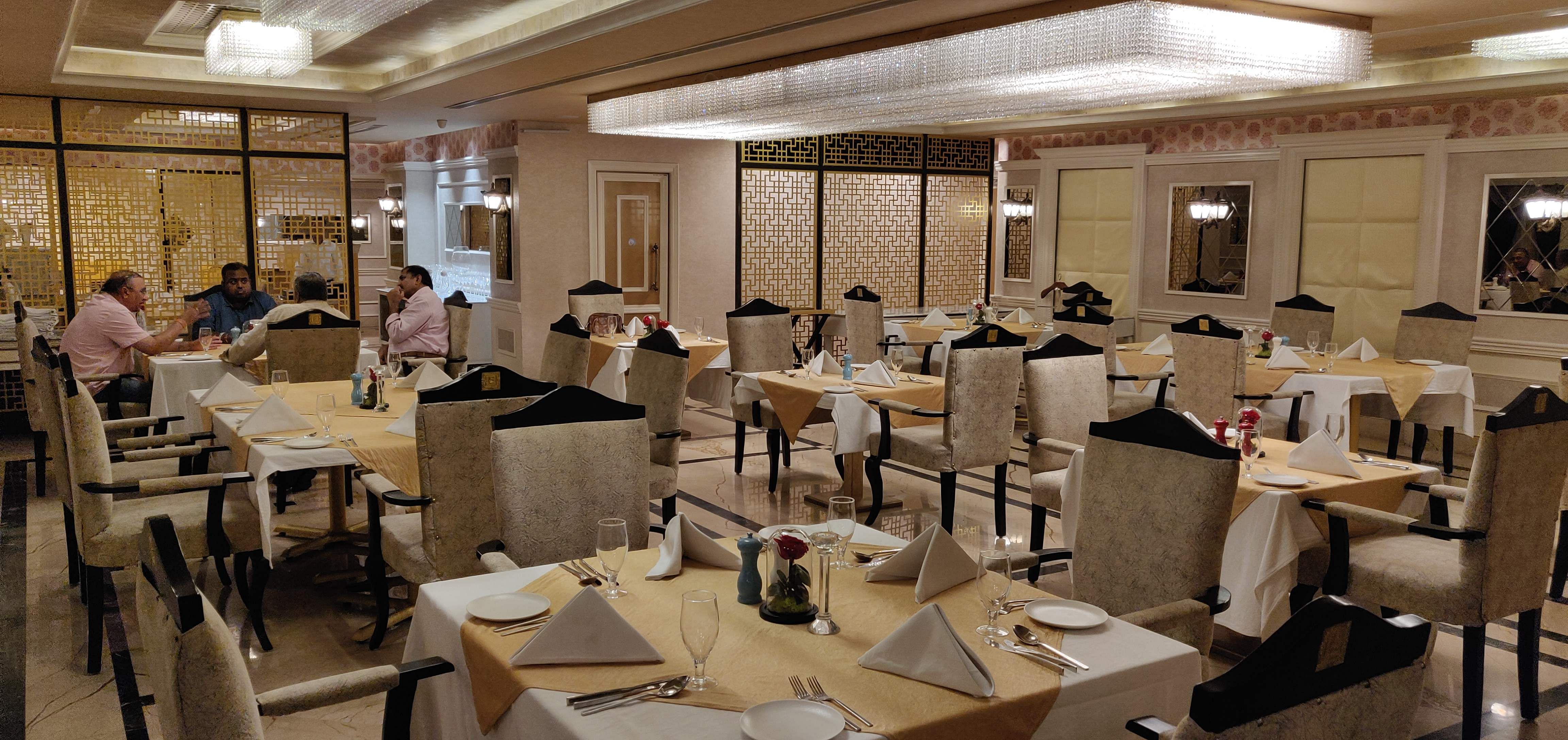 Restaurant,Room,Building,Interior design,Table,Function hall,Business,Furniture,Organization,Cafeteria