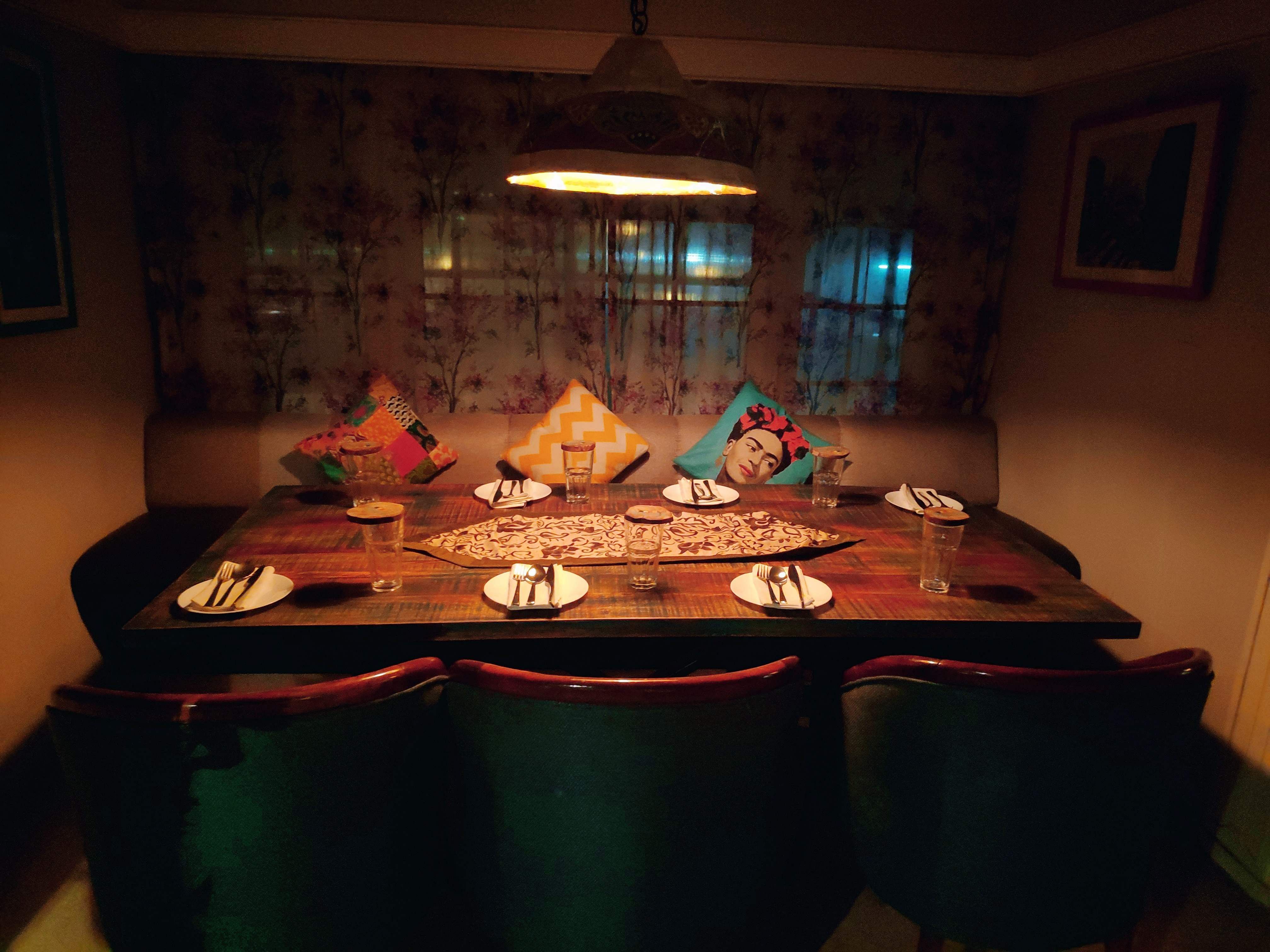 Room,Table,Lighting,Interior design,Furniture,Dining room,Tablecloth,Night,Meal,House