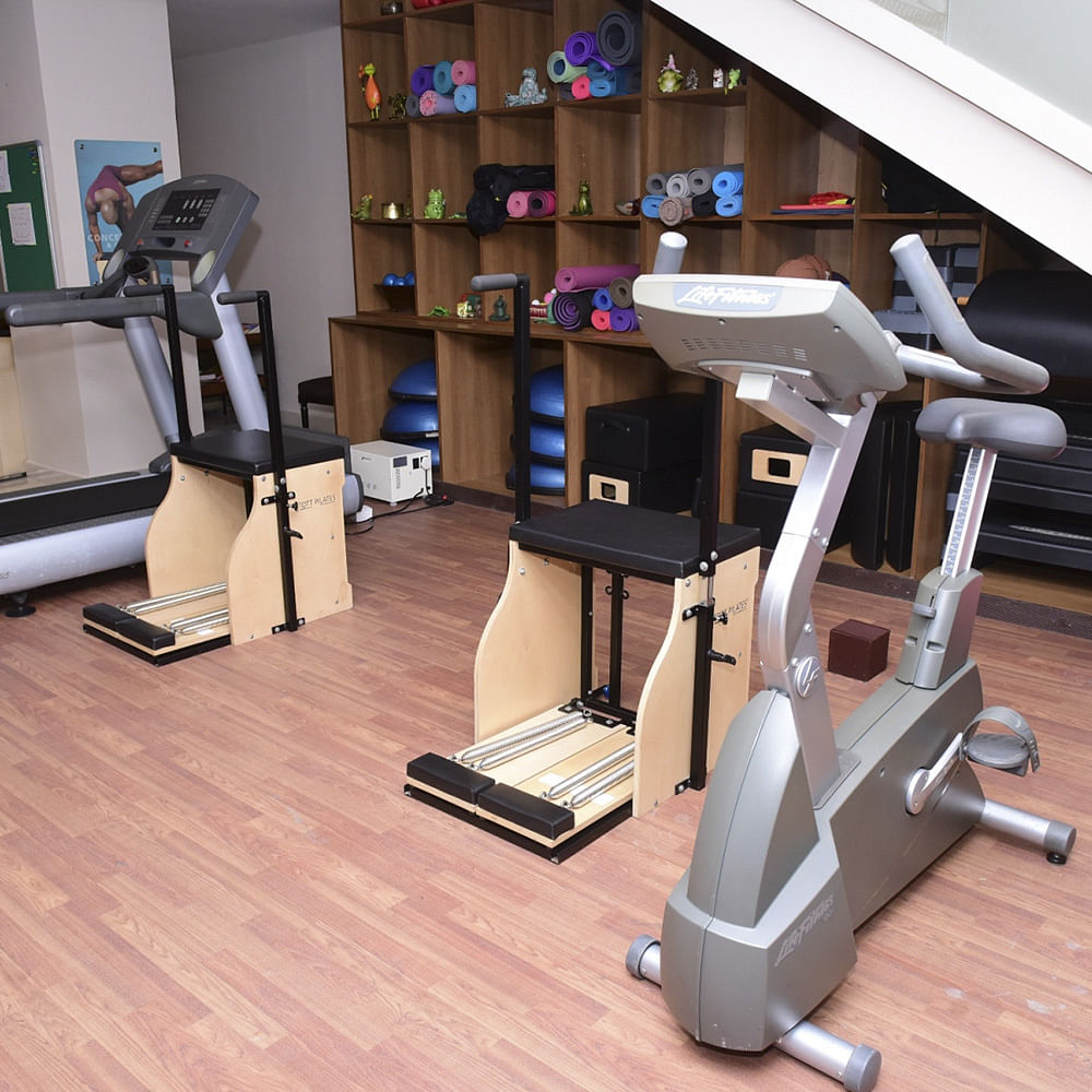 Gym,Room,Exercise equipment,Exercise machine,Flooring,Machine,Sport venue