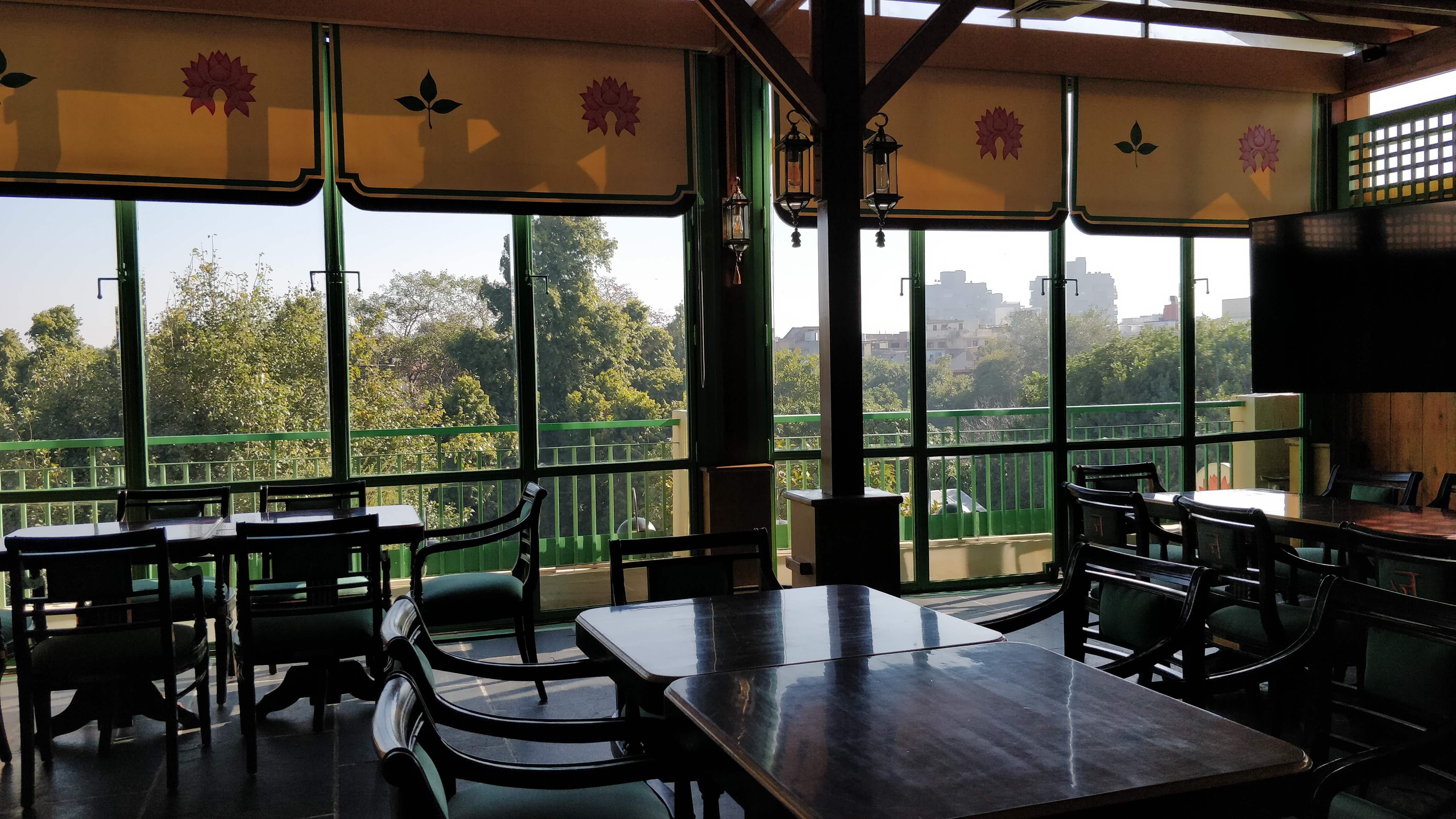 Property,Room,Building,Restaurant,Interior design,House,Porch,Table,Tree,Architecture