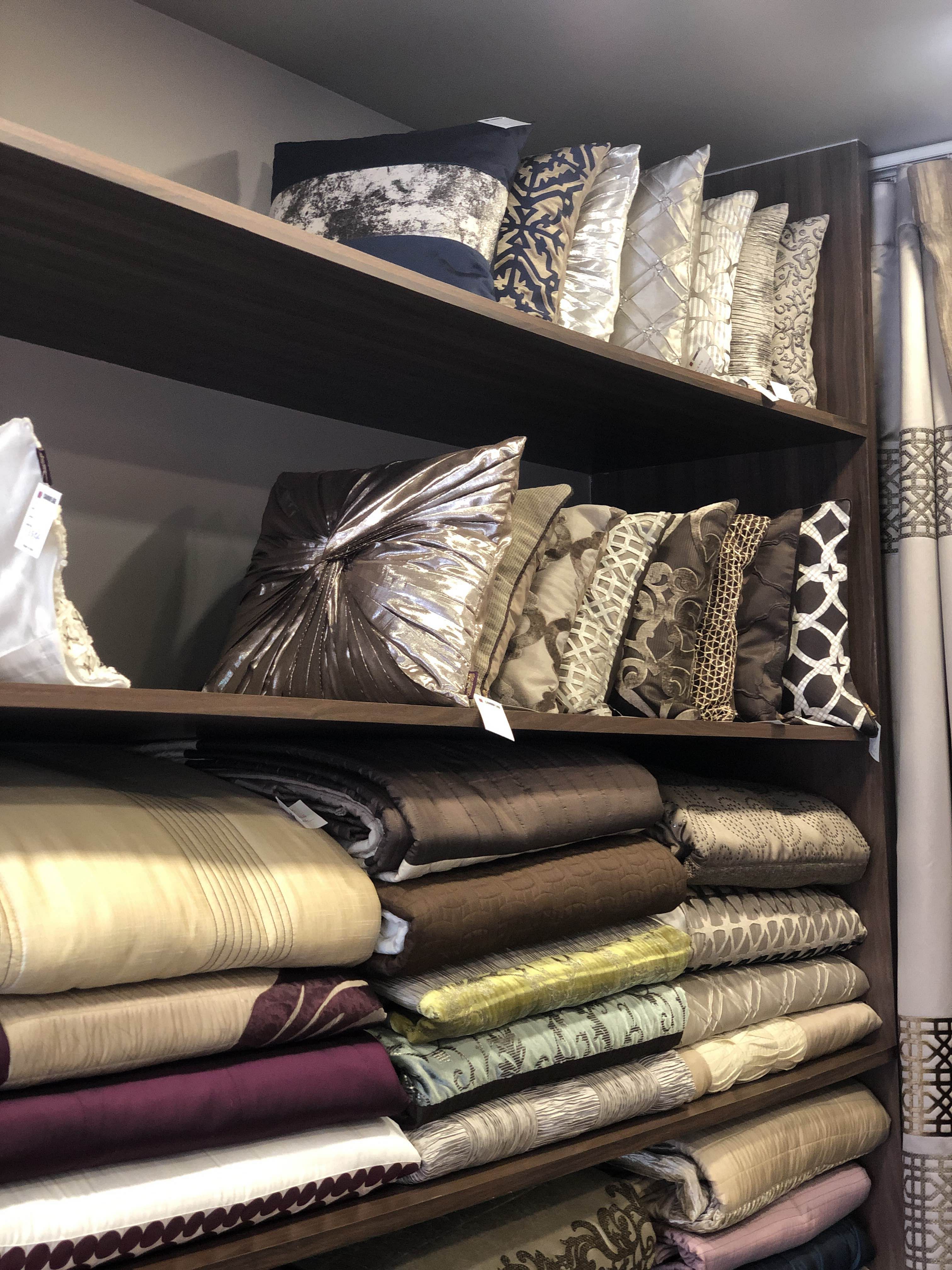 Room,Closet,Furniture,Textile,Linens,Bed sheet,Bedding,Shelf,Interior design,Book
