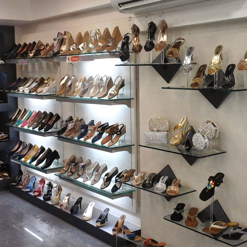 Shoe store,Footwear,Shoe,Collection,Shelf,Retail,Display case,Shelving,Shoe organizer,Furniture