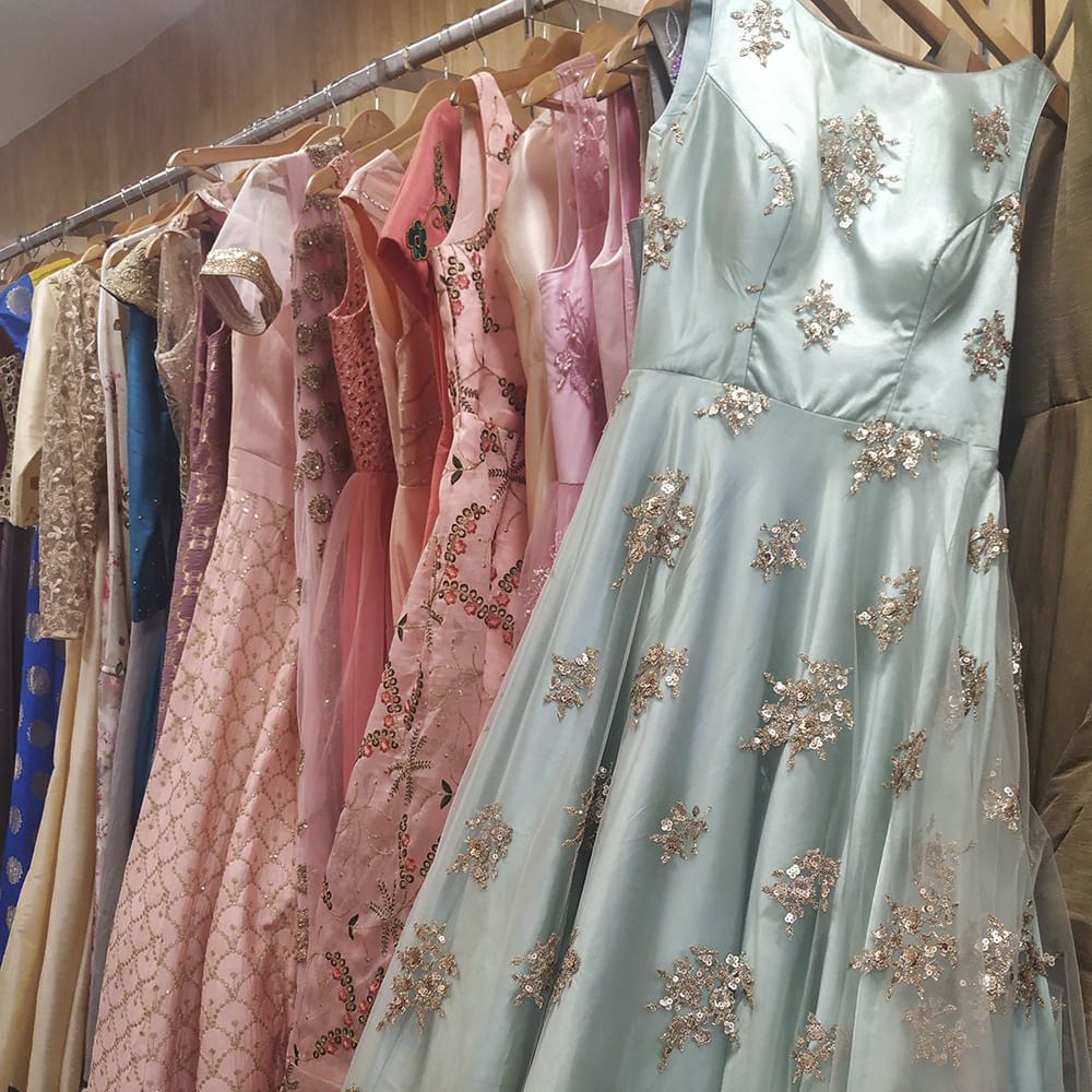 Clothing,Dress,Clothes hanger,Boutique,Pink,Peach,Room,Vintage clothing,Fashion,Day dress