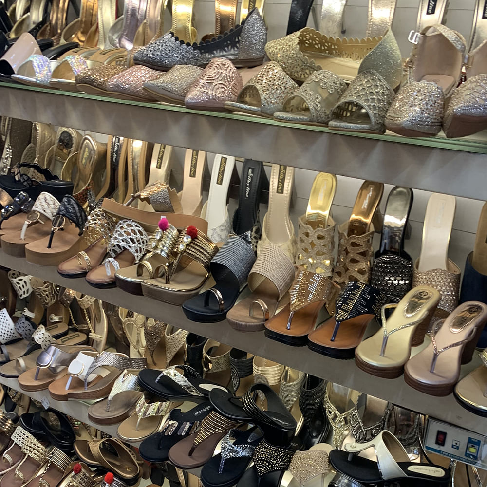 Footwear,Shoe store,Shoe,Dress shoe,High heels,Collection,Retail,Building,Hiking boot,Outlet store