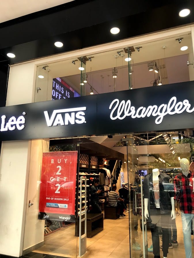 Outlet store,Building,Retail,Shopping mall,Footwear,Interior design,Shoe,Boutique,Advertising