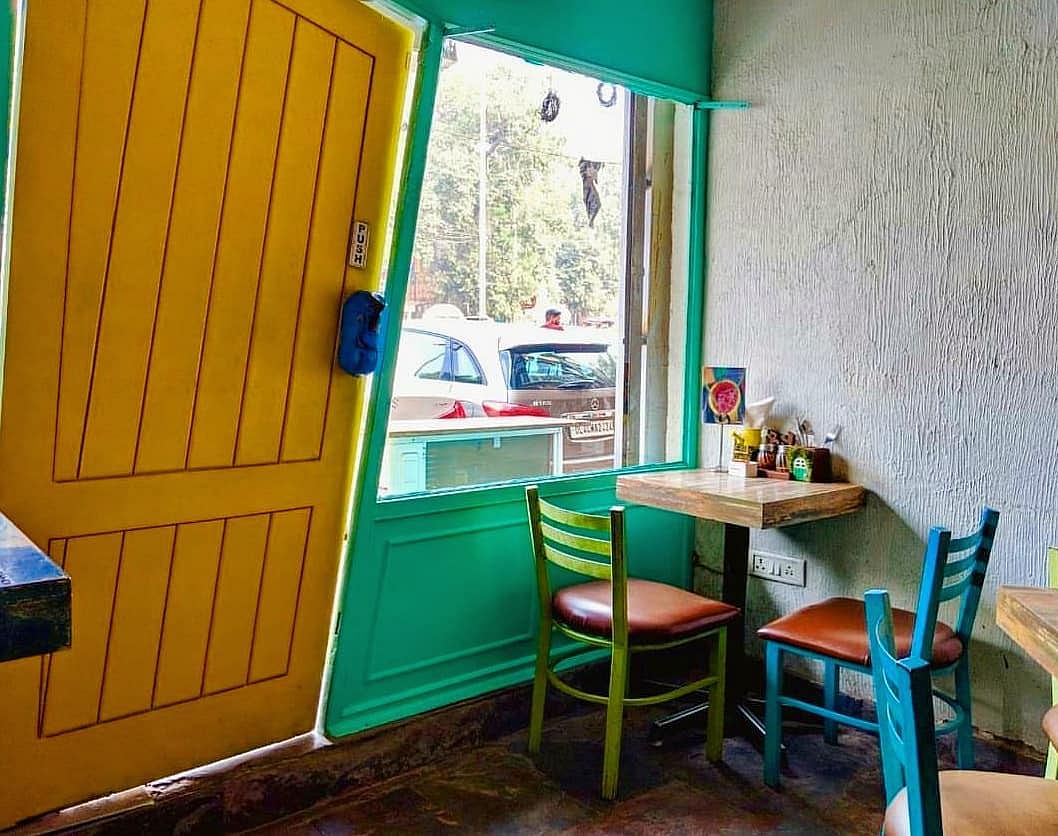 Green,Blue,Turquoise,Room,Yellow,Furniture,Wall,Table,Interior design,Building