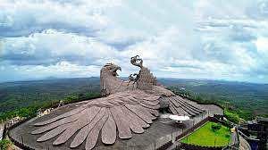 Landmark,Landscape,Photography,Historic site,Bird of prey,Mountain,Roof,Wing,Tourist attraction,Mountain range