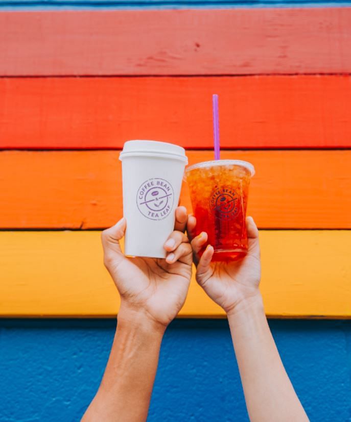 Orange,Drink,Cup,Hand,Cup,Juice,Pint glass,Non-alcoholic beverage,Slush