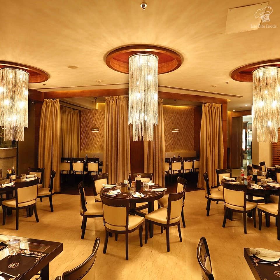 Restaurant,Building,Room,Interior design,Furniture,Table,Ceiling,Hotel,Café,Business