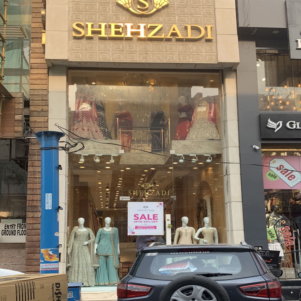 Car,Vehicle,Display window,Building,Luxury vehicle,Automotive design,Mid-size car,Retail,Boutique,City car