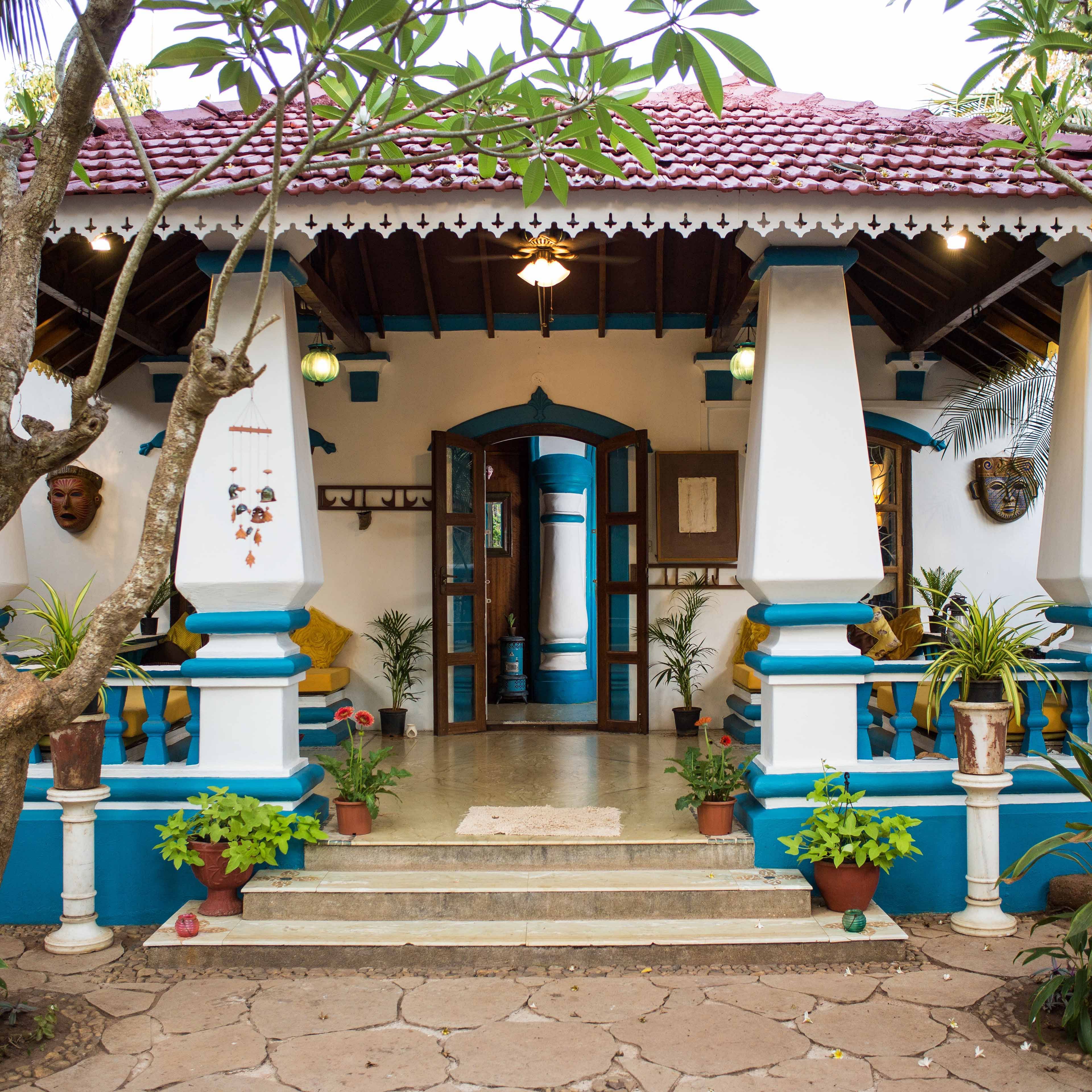 Building,Majorelle blue,House,Architecture,Facade,Leisure,Courtyard,Temple,Plant,Home