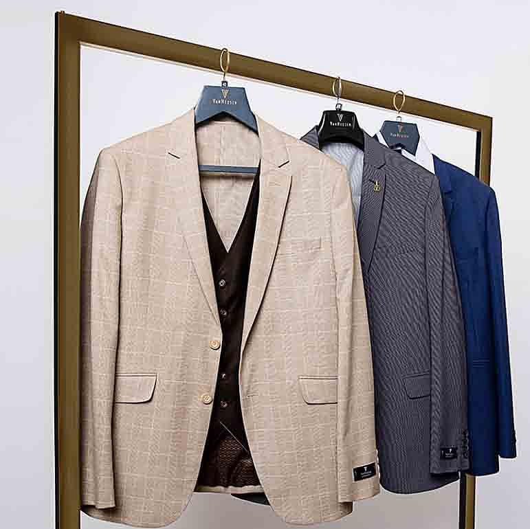 Suit,Clothing,Clothes hanger,Outerwear,Blazer,Formal wear,Jacket,Tuxedo,Room,Beige