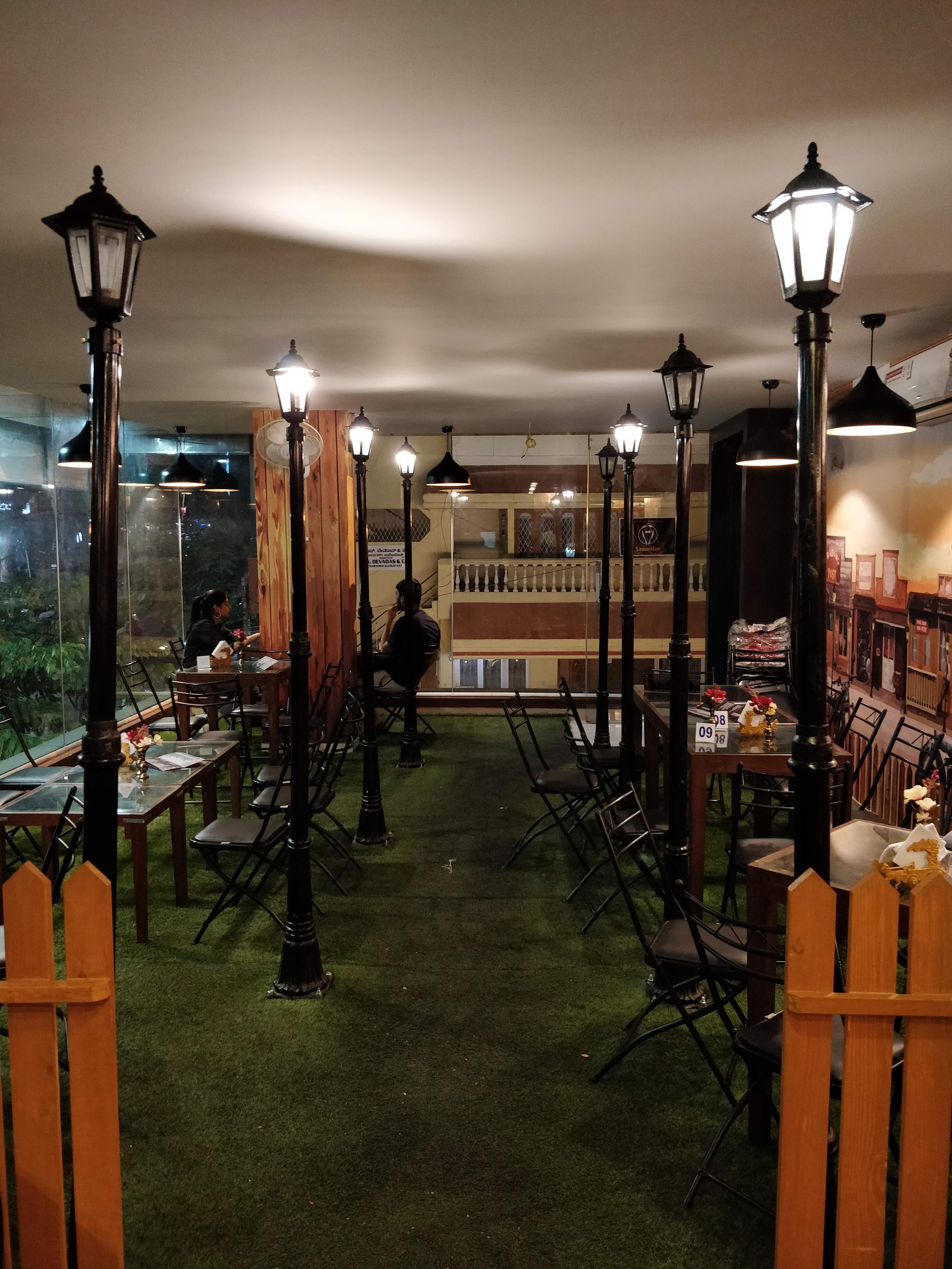 Lighting,Building,Interior design,Light fixture,Furniture,Room,Architecture,Restaurant,Aisle,Ceiling