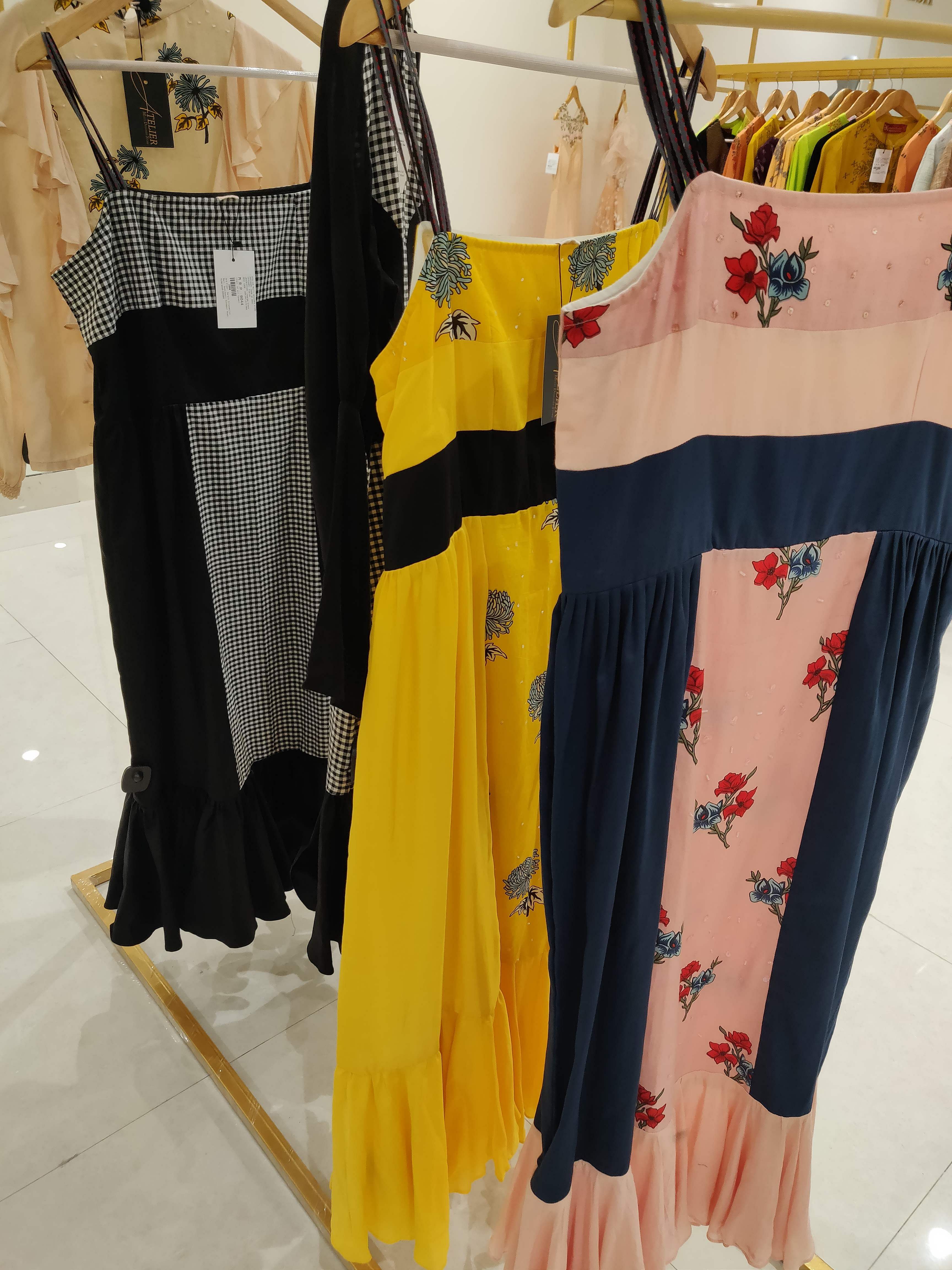 Clothing,Boutique,Yellow,Clothes hanger,Dress,Costume design,Room,Trousers,Fashion design