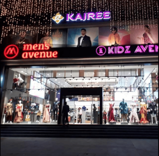 Building,Sky,Night,Electronic signage,Display advertising,Advertising,Facade,Outlet store,Signage