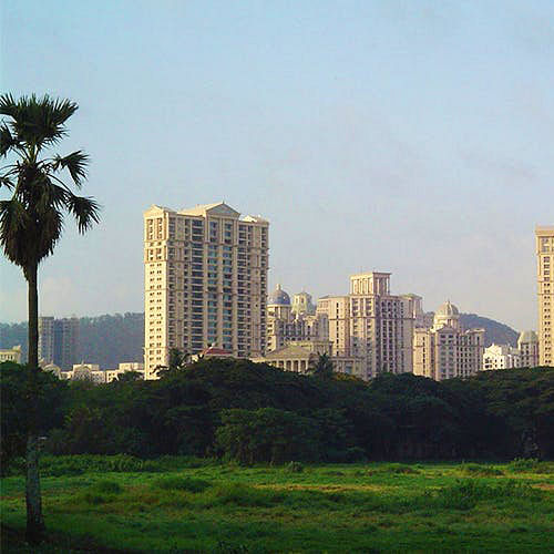 Metropolitan area,Daytime,City,Tower block,Sky,Tree,Skyline,Urban area,Human settlement,Skyscraper