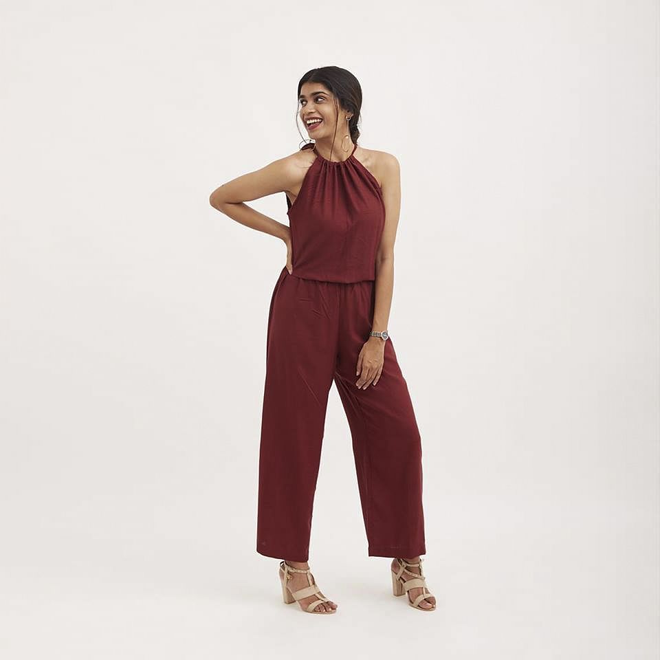 Clothing,Shoulder,Maroon,Waist,Neck,Standing,Trousers,Leg,Joint,Magenta