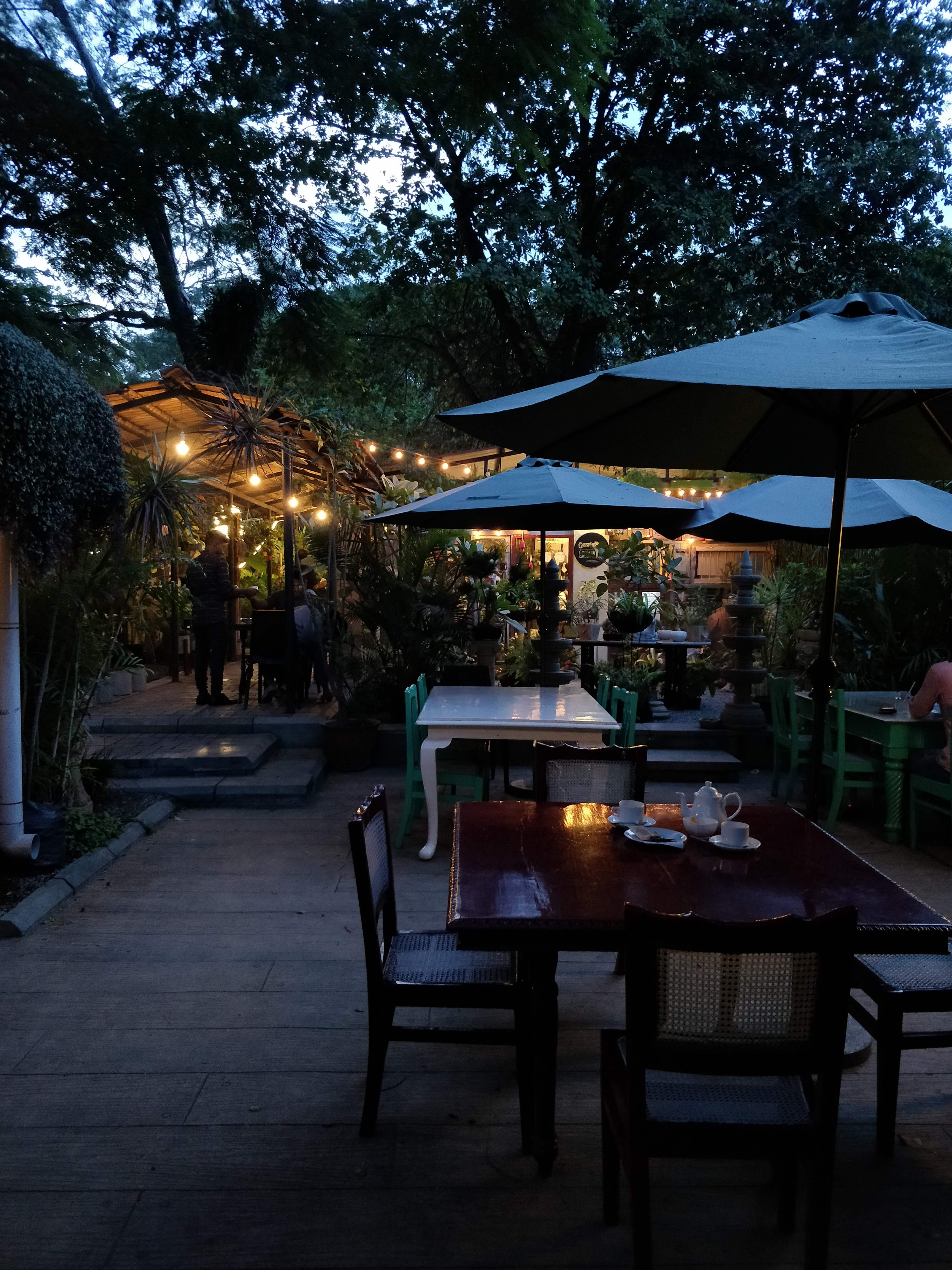 Restaurant,Sky,Lighting,Night,Tree,Evening,Table,Atmosphere,Patio,Building