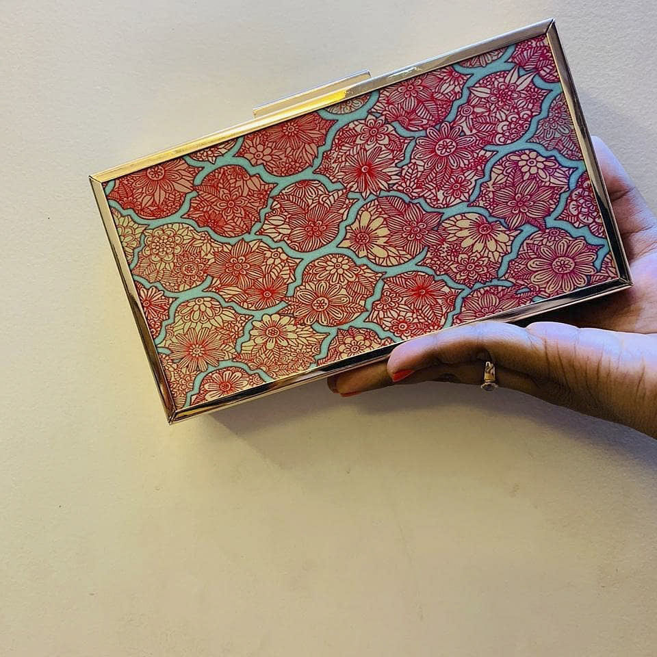 Red,Pattern,Orange,Motif,Visual arts,Design,Wallet,Paisley,Coin purse,Fashion accessory