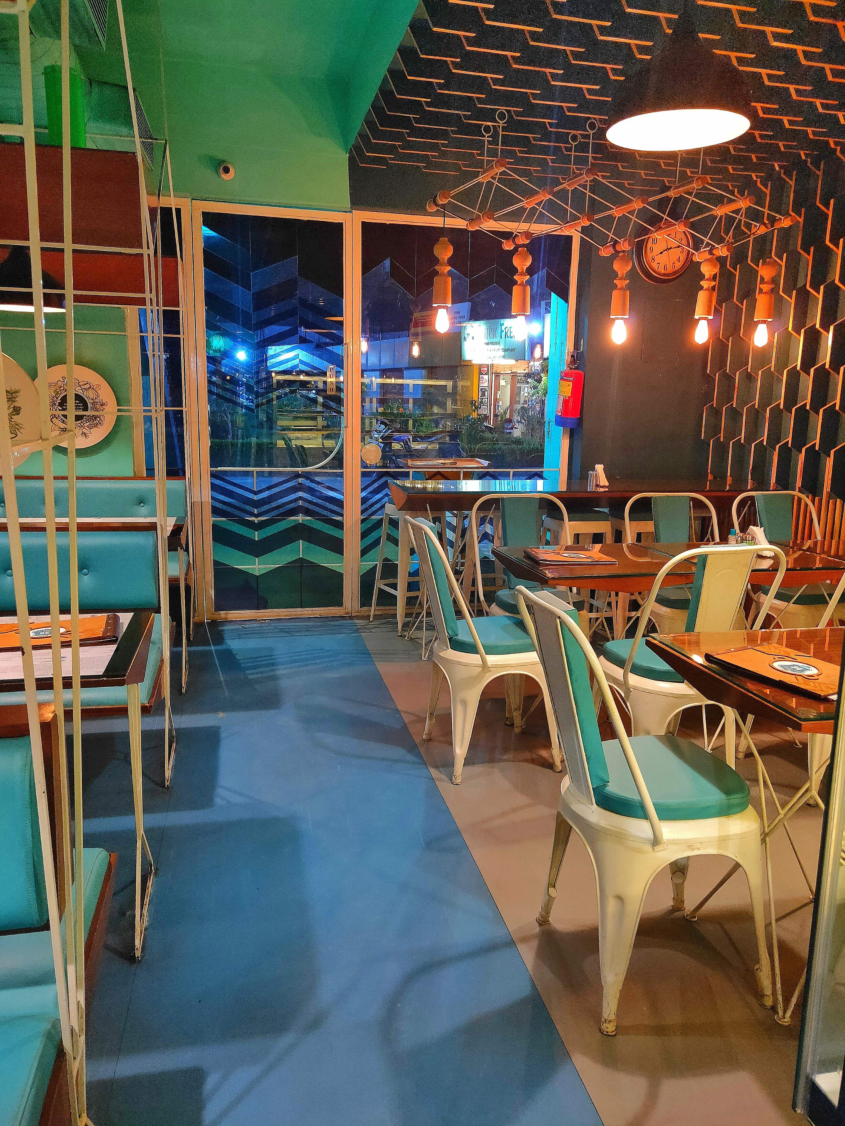 Room,Interior design,Restaurant,Turquoise,Building,Leisure,Table,Games,Architecture,Furniture