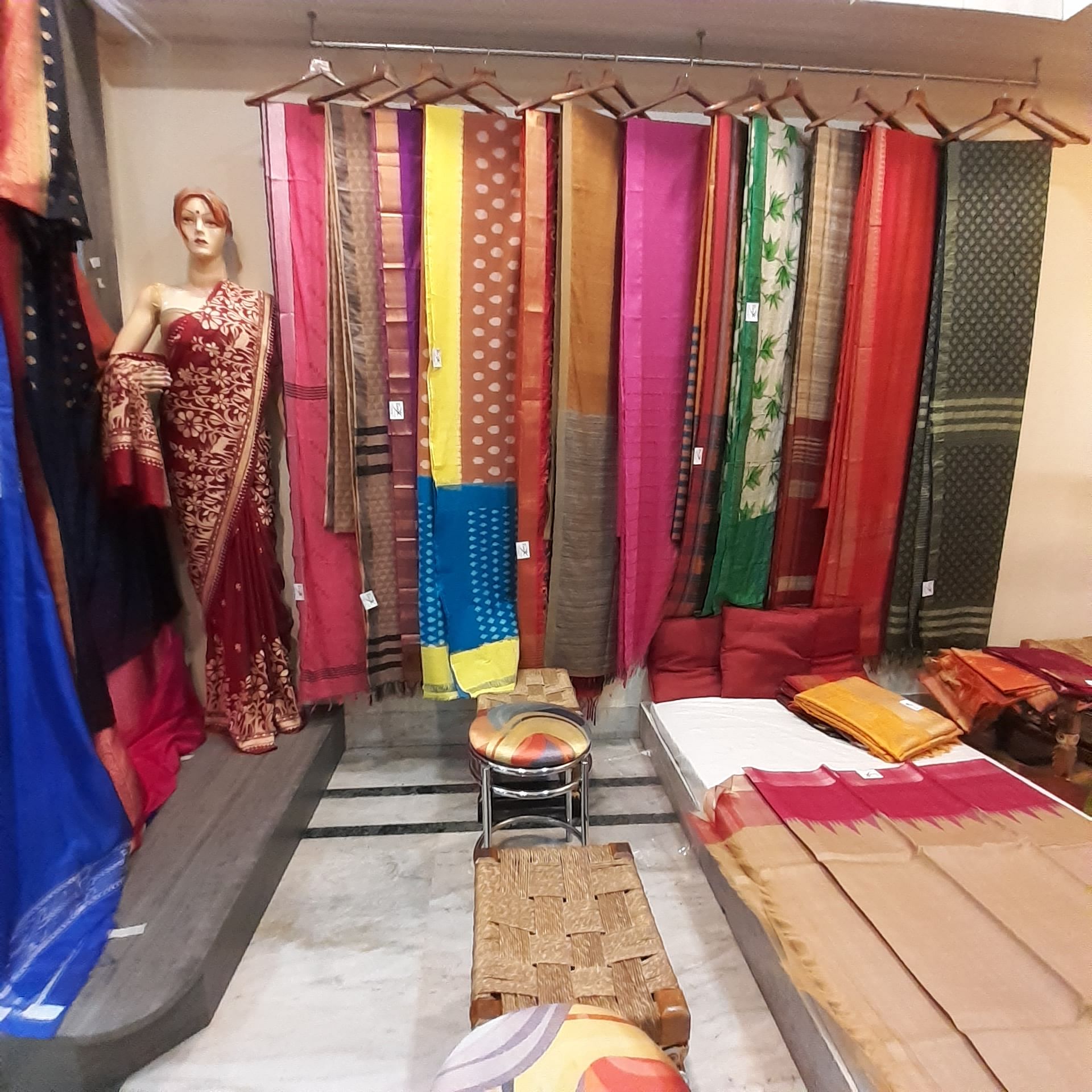 Boutique,Room,Textile,Interior design,Closet,Formal wear,Curtain,Furniture,Dress,Sari