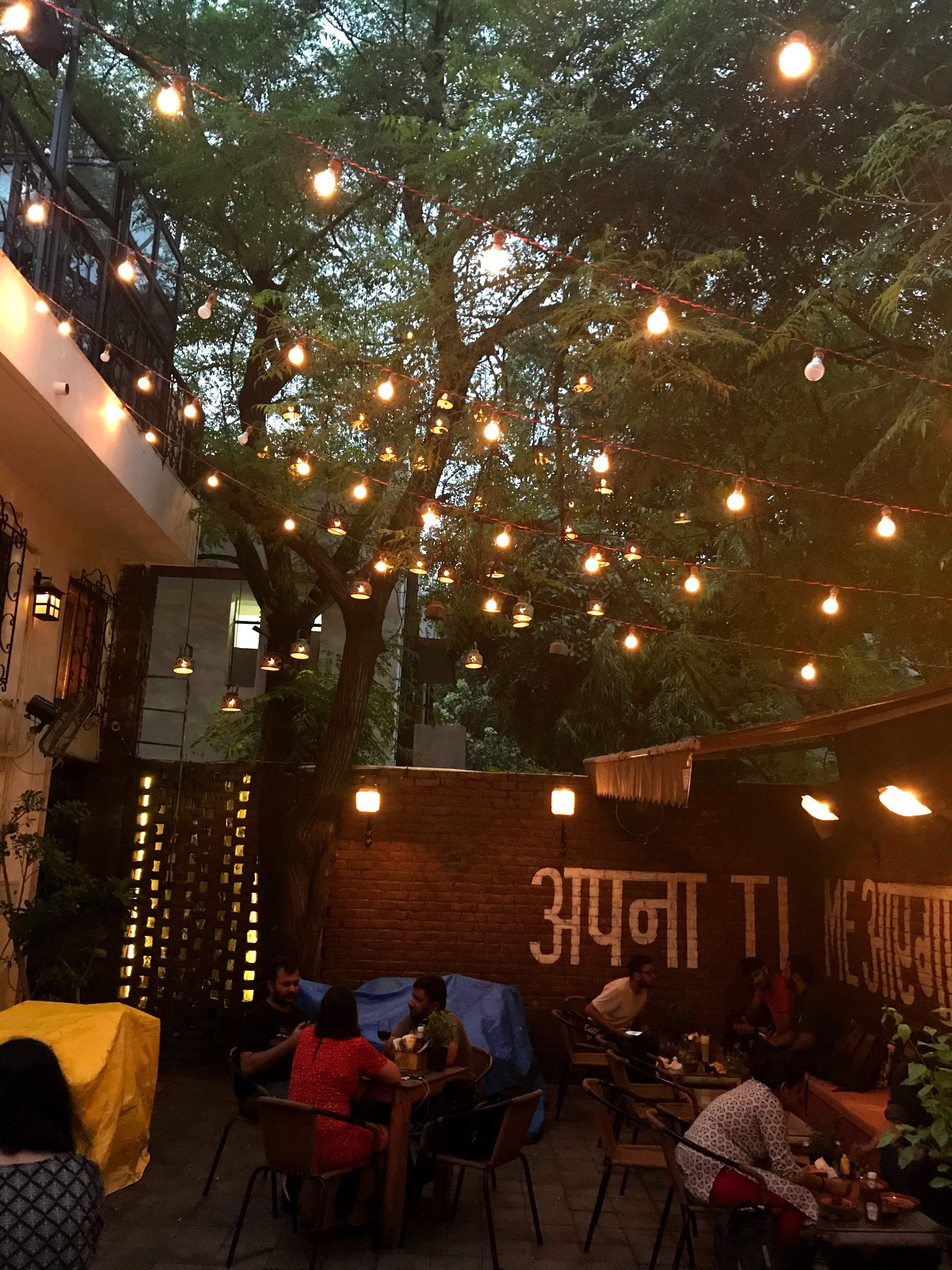 Restaurant,Lighting,Tree,Night,Table,Building,Plant,Café,Business