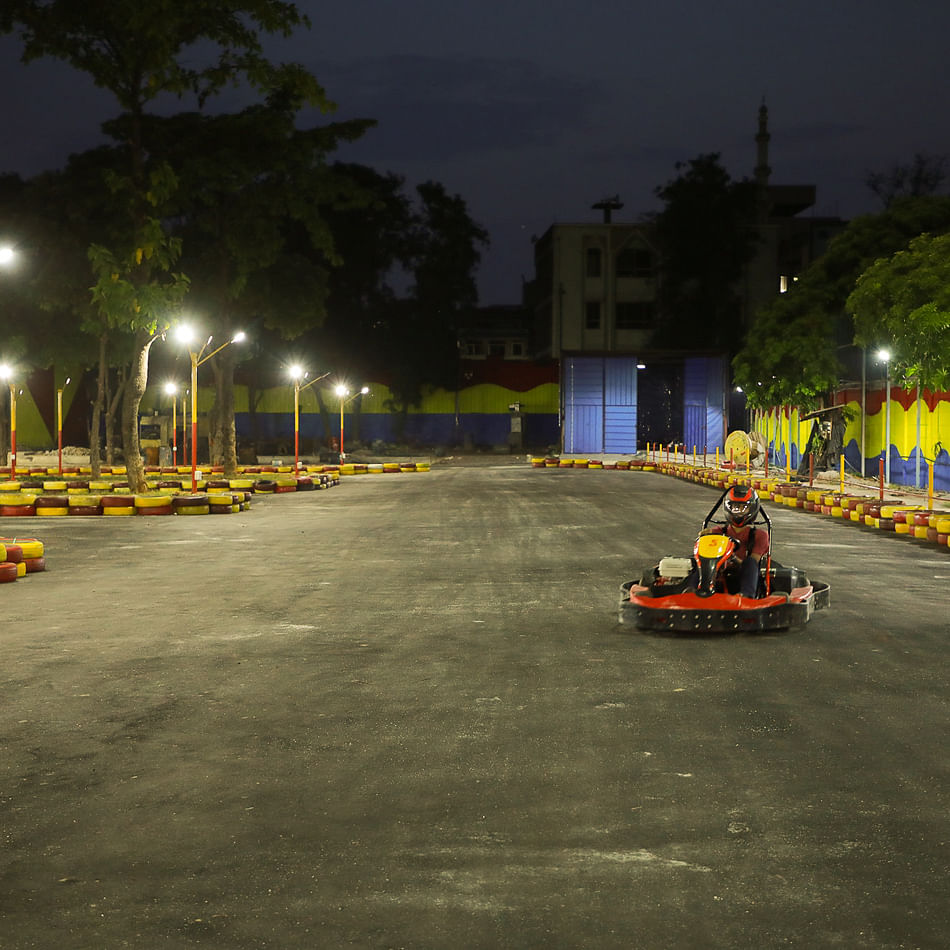 Kart racing,Go-kart,Asphalt,Vehicle,Road surface,Road,Car,Racing,Street,Night