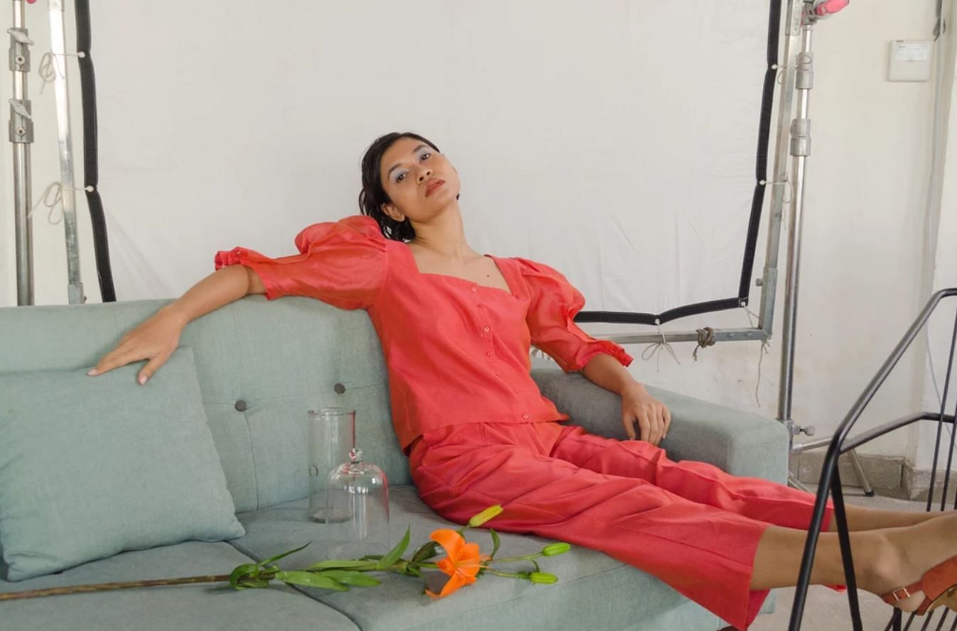 Red,Shoulder,Orange,Leg,Joint,Textile,Sitting,Neck,Knee,Trunk
