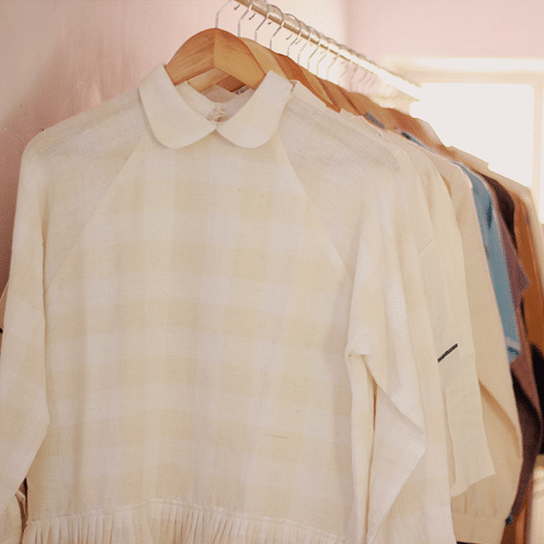 Clothing,White,Clothes hanger,Shoulder,Sleeve,Collar,Beige,Shirt,Blouse,Outerwear