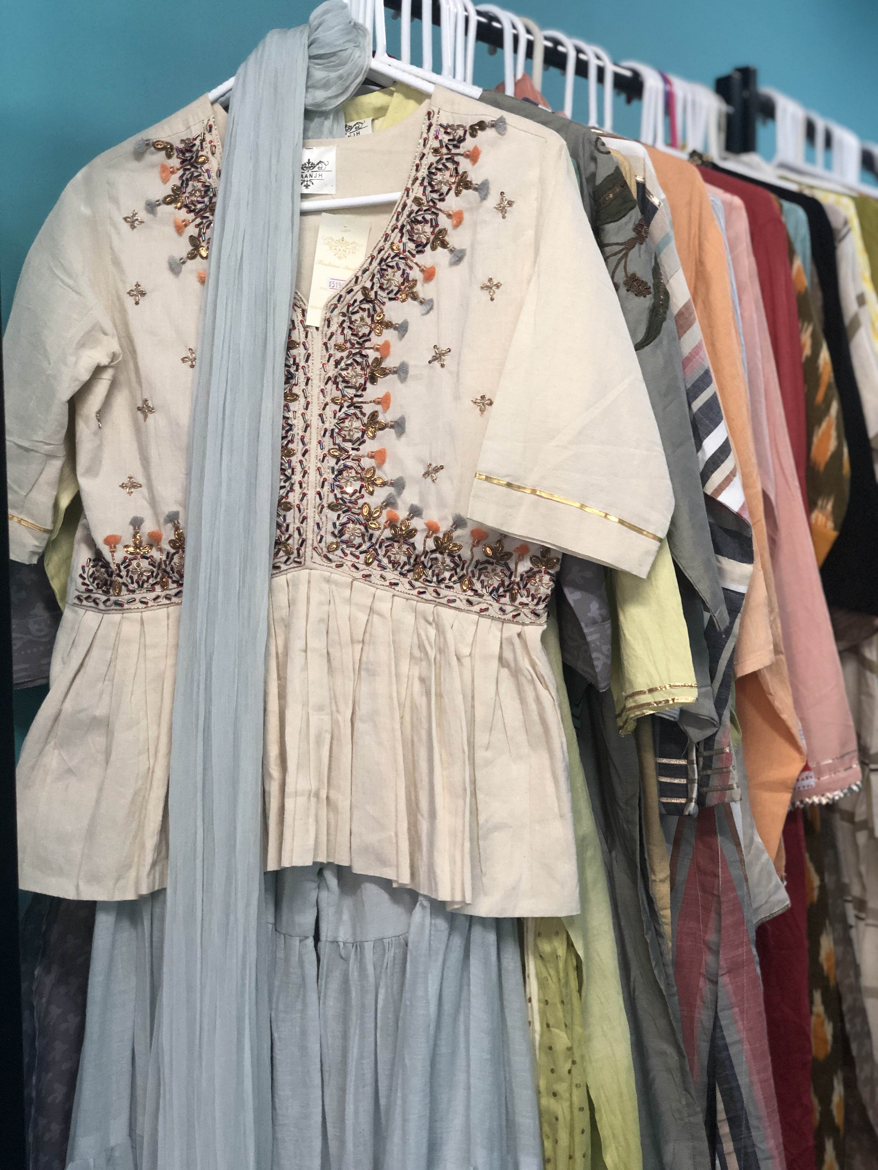 Clothing,Fashion,Dress,Outerwear,Textile,Fashion design,Costume design,Clothes hanger,Costume,Vintage clothing