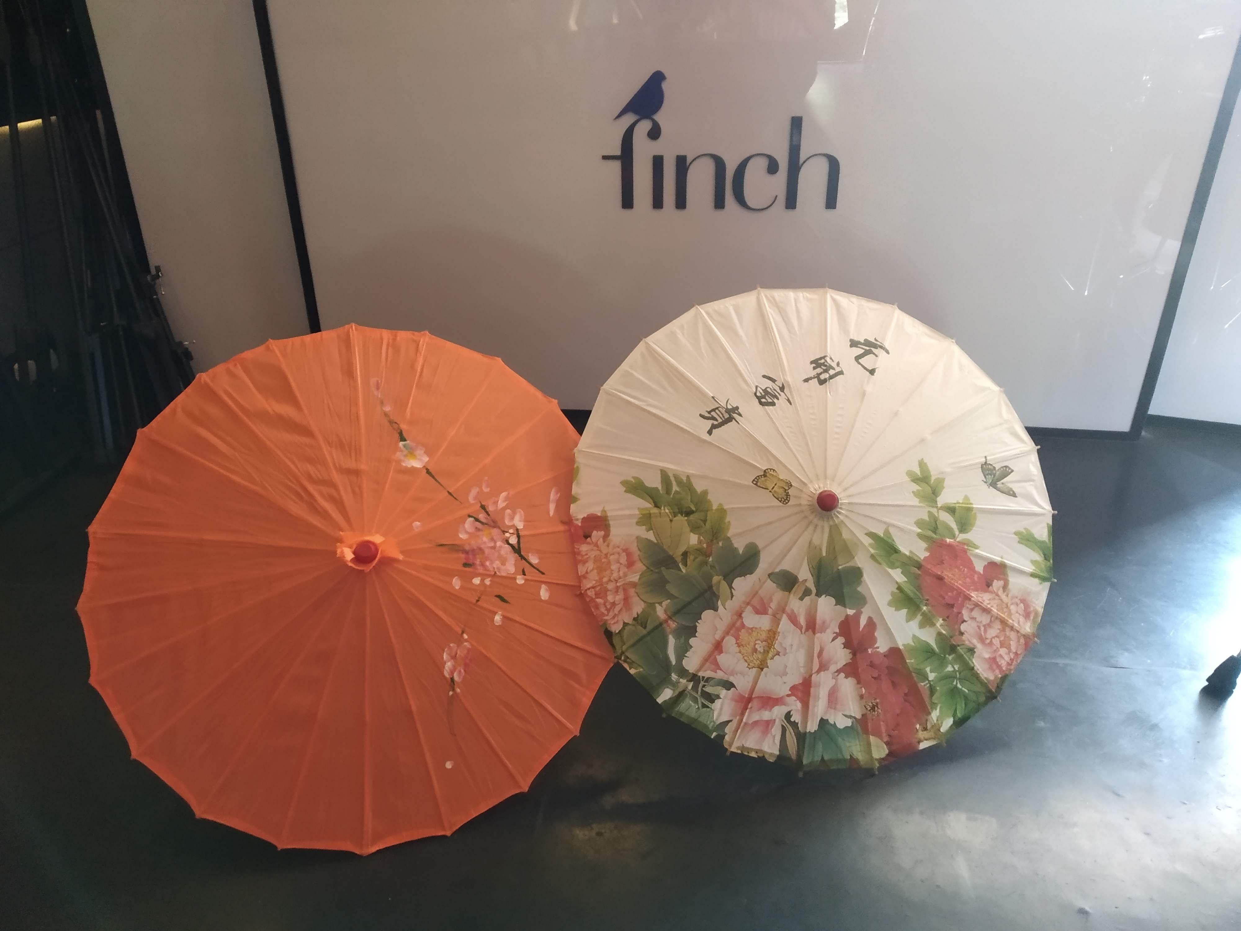 Orange,Umbrella,Peach,Fashion accessory,Flower,Table,Plant,World,Circle,CD