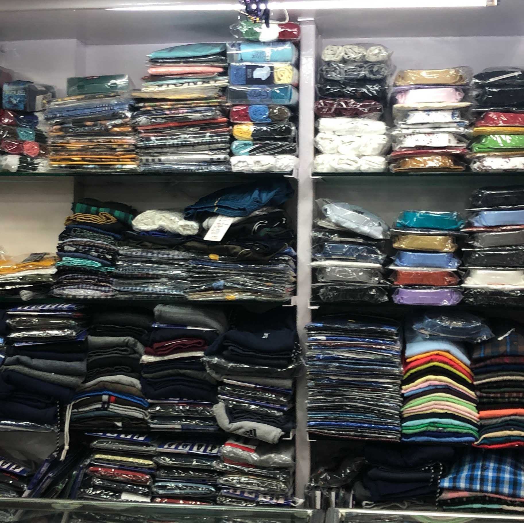 Footwear,Room,Outlet store,Closet,Collection,Textile,Sportswear,Shelf,Fashion accessory,T-shirt