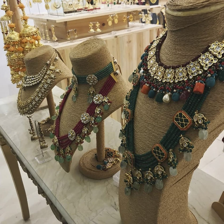 Jewellery,Fashion accessory,Fashion,Joint,Footwear,Tradition,Necklace,Neck,Shoe,Metal