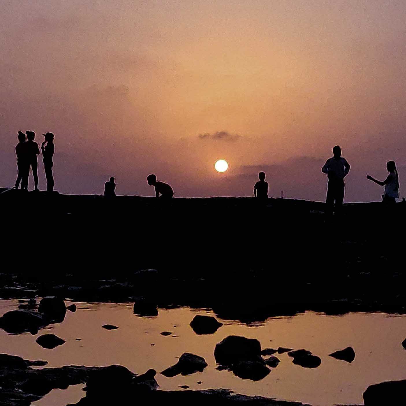 People in nature,Sky,Water,Silhouette,Sunset,Reflection,Horizon,Sea,Cloud,Evening