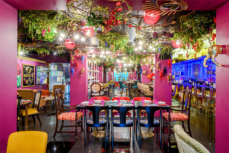 Pink,Room,Interior design,Building,Restaurant,Magenta,Tree,Architecture,Furniture,Table