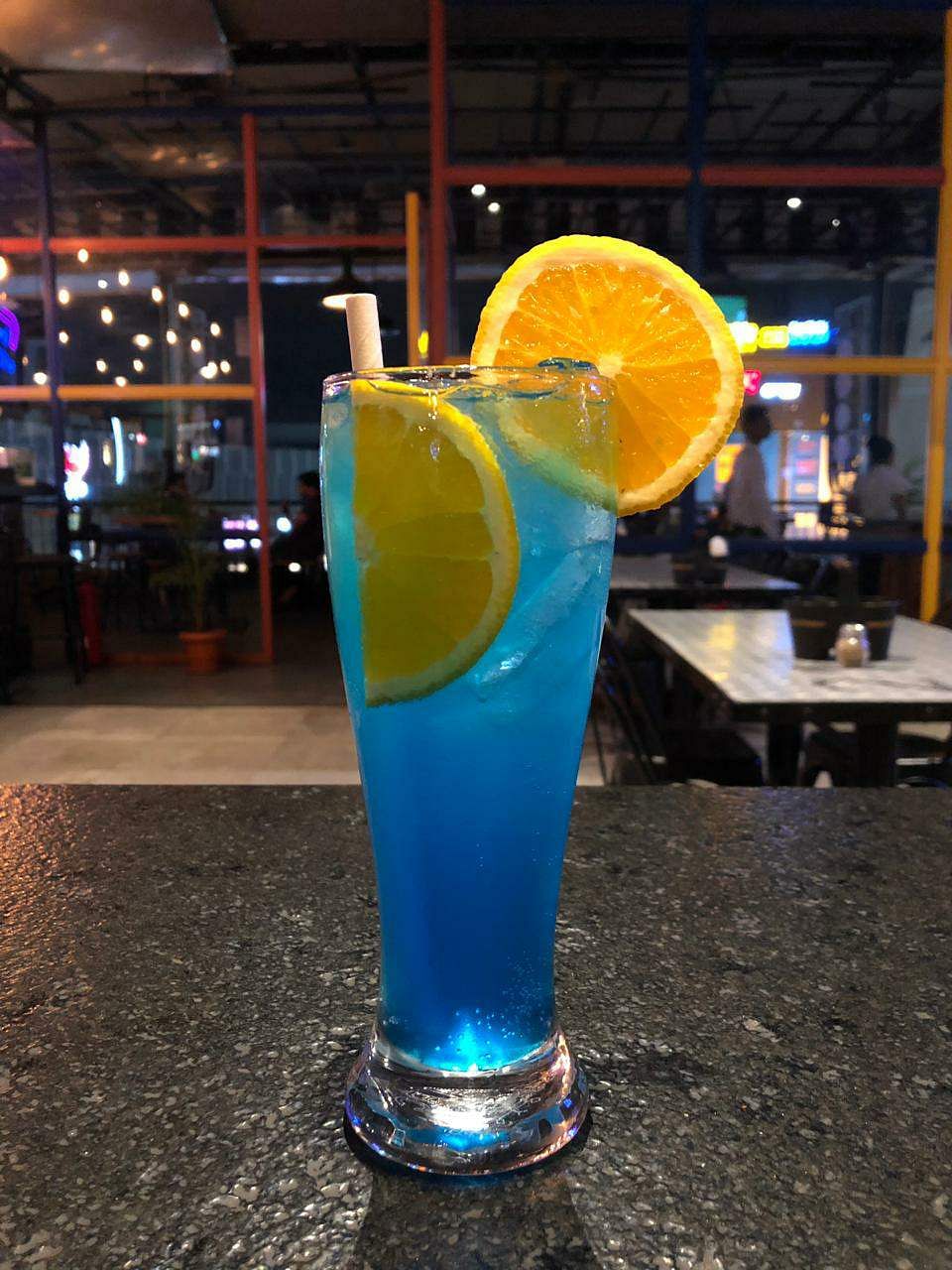 Drink,Non-alcoholic beverage,Distilled beverage,Blue lagoon,Alcoholic beverage,Cocktail garnish,Blue hawaii,Juice,Lemonsoda,Liqueur