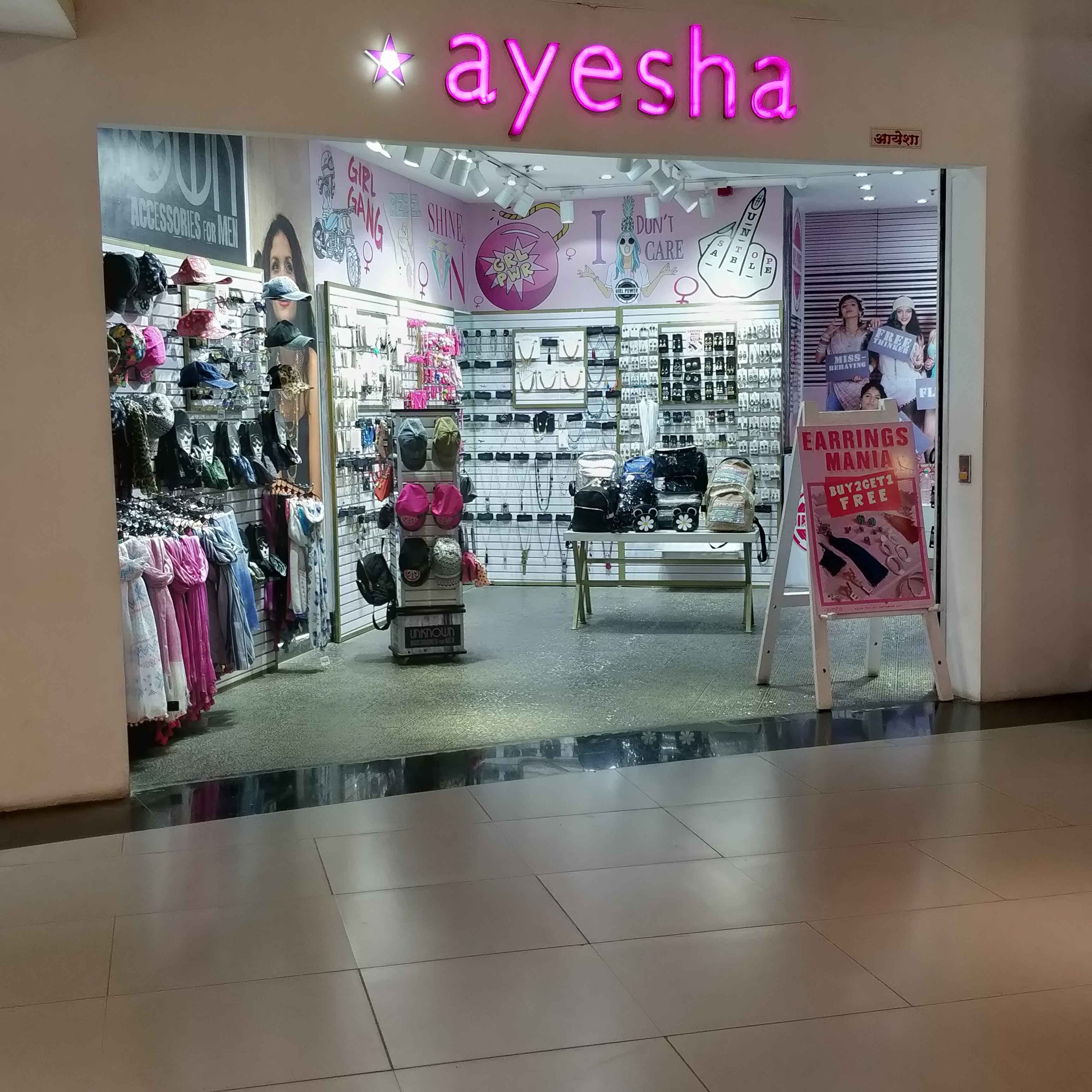 Boutique,Outlet store,Pink,Building,Retail,Footwear,Floor,Interior design,Shopping mall,Flooring