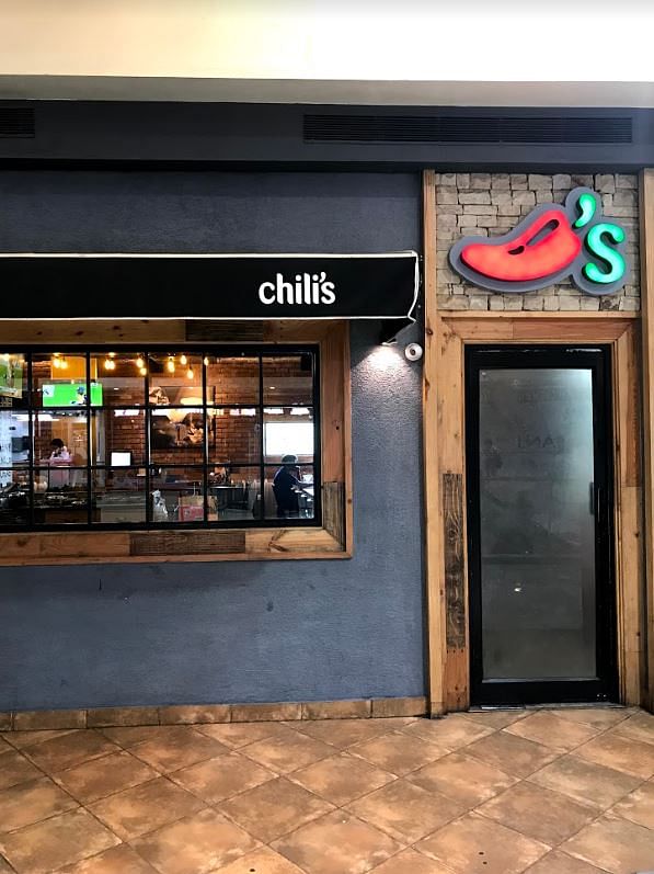 Building,Footwear,Signage,Restaurant,Facade,Door,Fast food restaurant,Shoe,Business