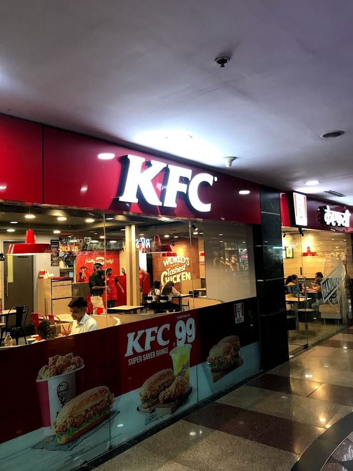 Building,Fast food restaurant,Night,Restaurant,Food court,Fast food,Interior design,Outlet store,Retail