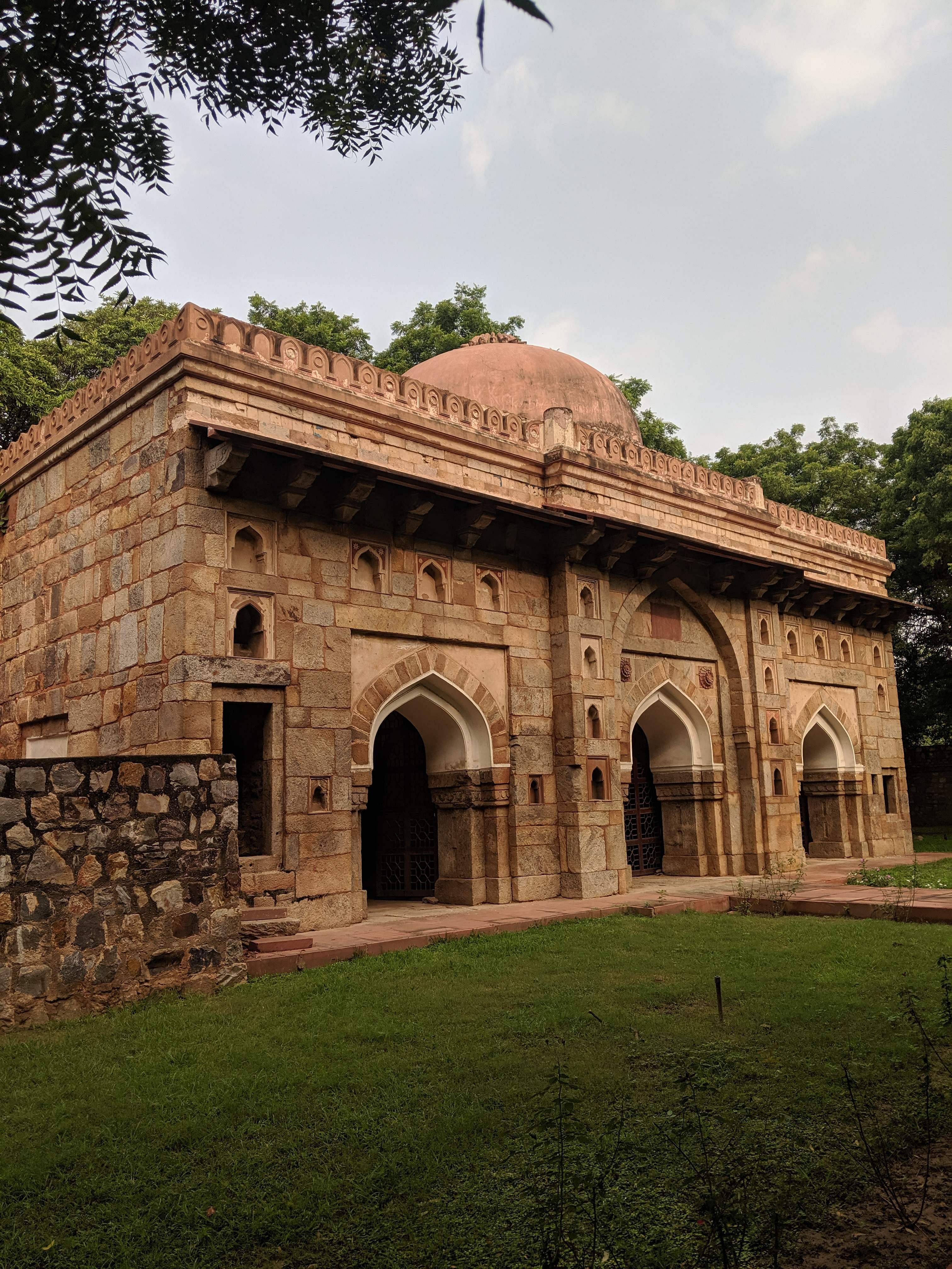 Building,Architecture,Arch,Historic site,Estate,Grass,Tree,Mausoleum,Fortification,Ancient history