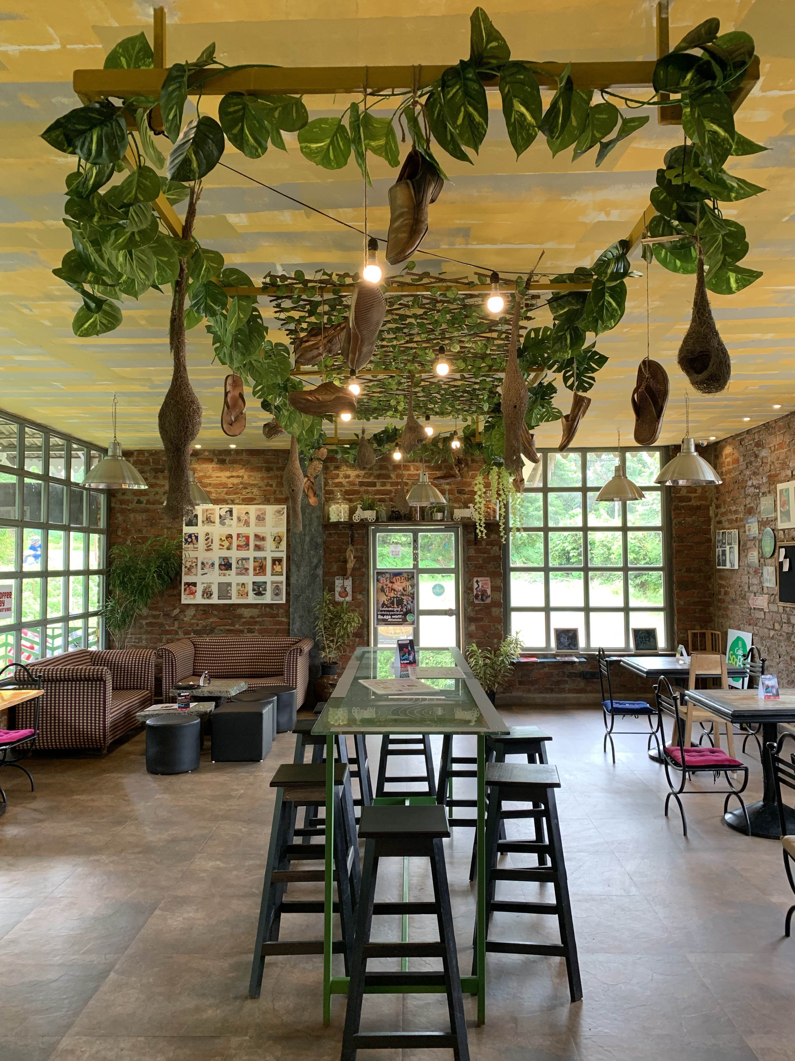 Green,Room,Interior design,Building,Table,Tree,Restaurant,Furniture,Architecture,Ceiling