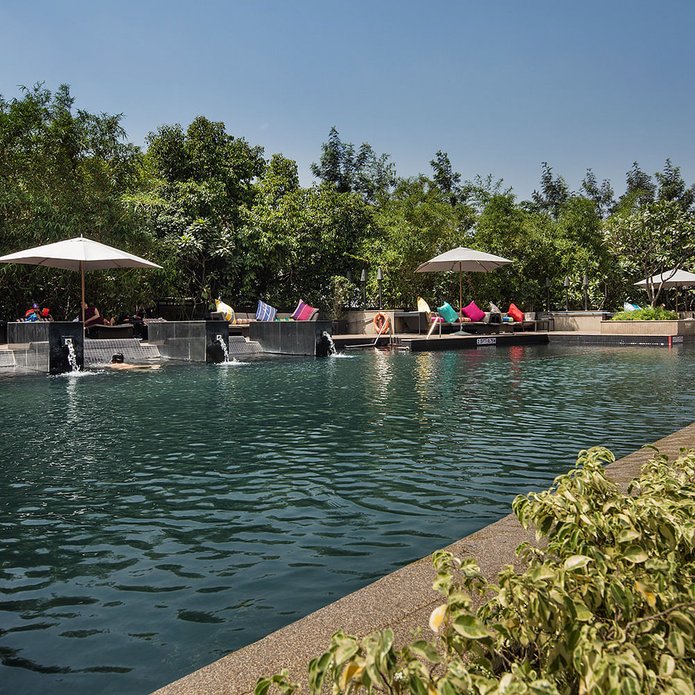 Swimming pool,Leisure,Water,Sky,Resort,Vacation,Botany,Mountain,Tourism,Tree