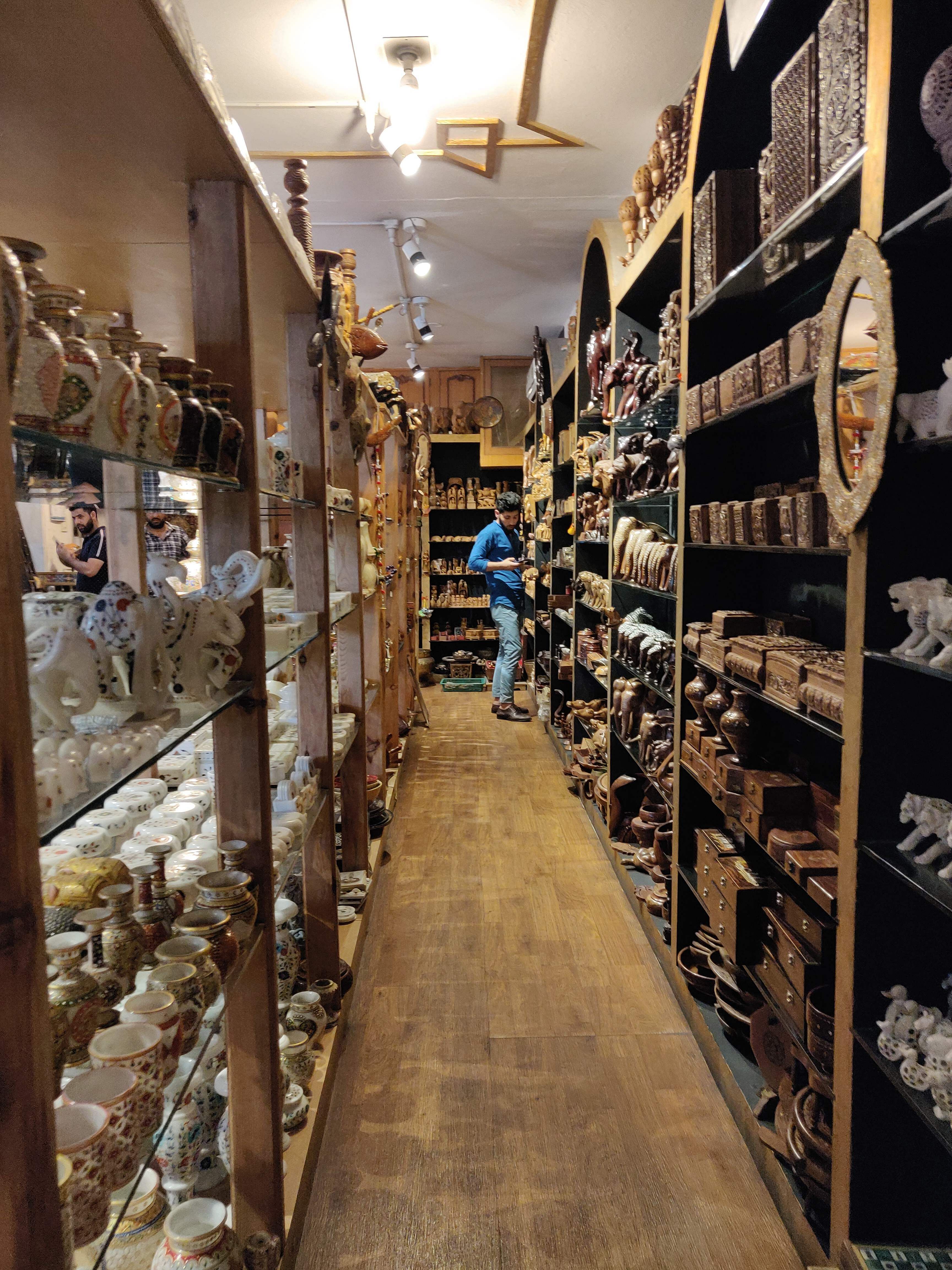Aisle,Footwear,Building,Inventory,Shoe store,Shoe,Collection,Interior design,Warehouse,Room