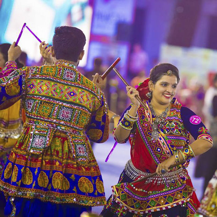 Dancer,Folk dance,Tradition,Performance,Event,Festival,Dance,Performing arts,Performance art,Magenta