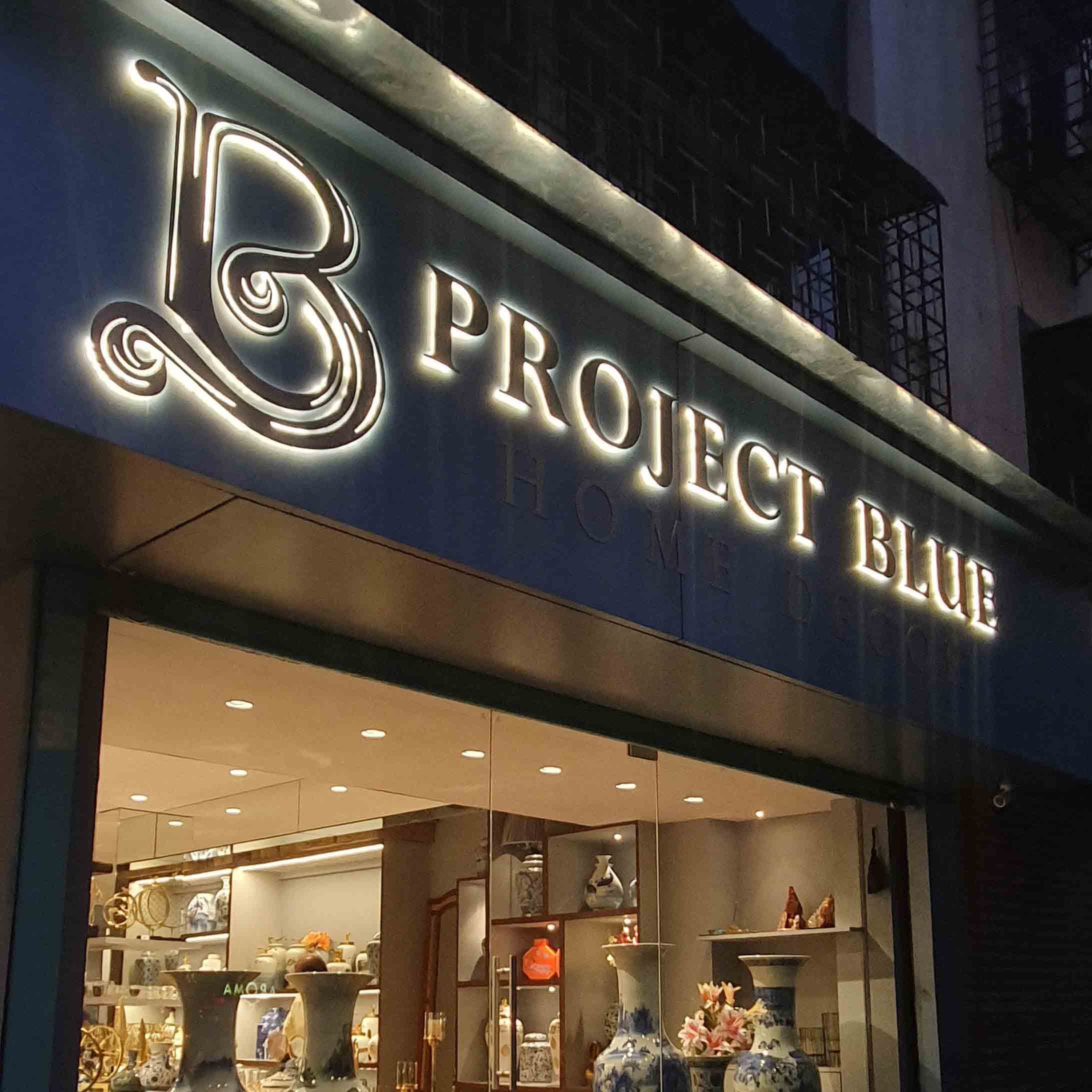 Building,Outlet store,Font,Architecture,Facade,Signage,Metal