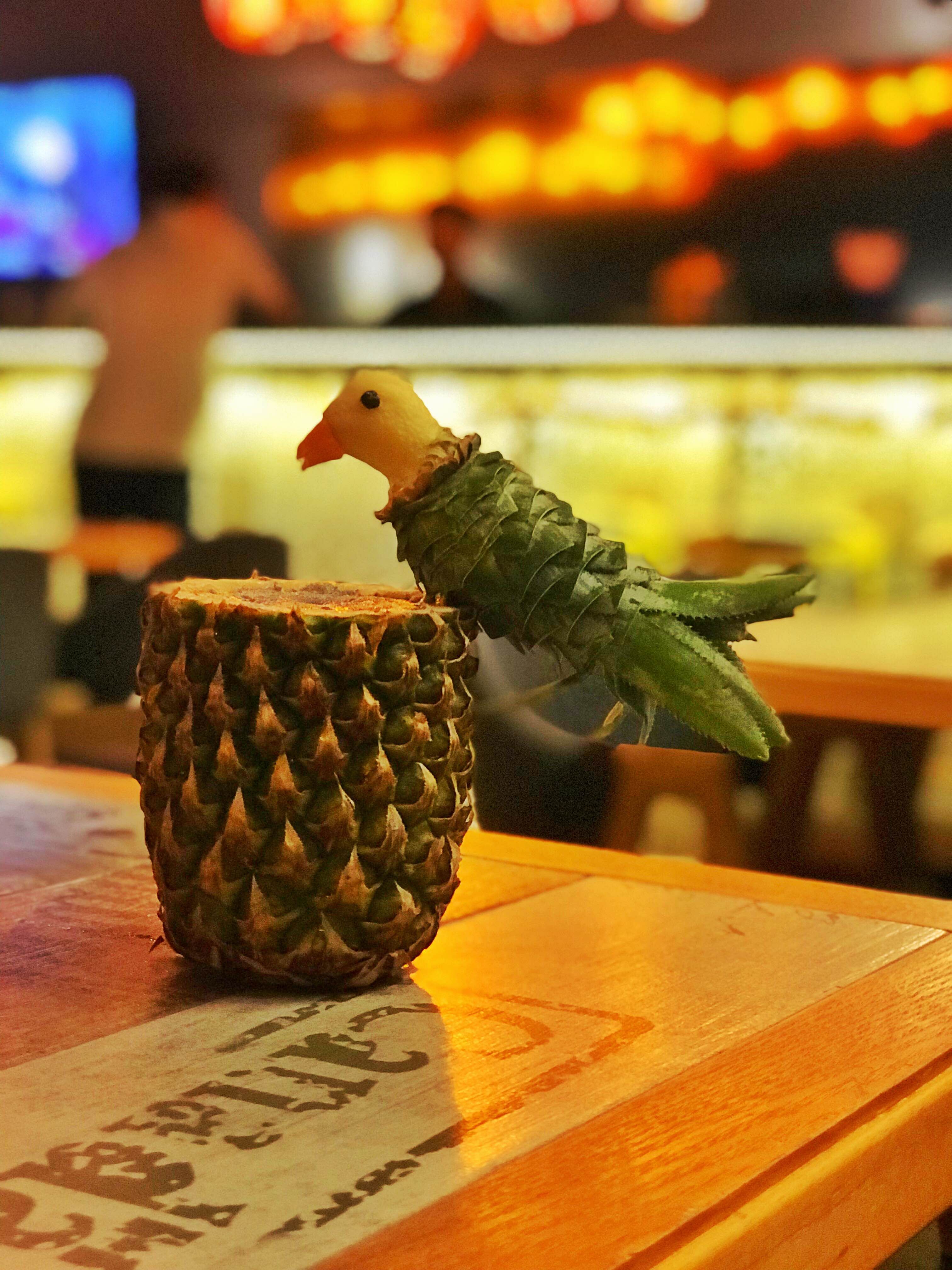 Pineapple,Ananas,Plant,Conifer cone,Table,Bird,Fruit,Barware