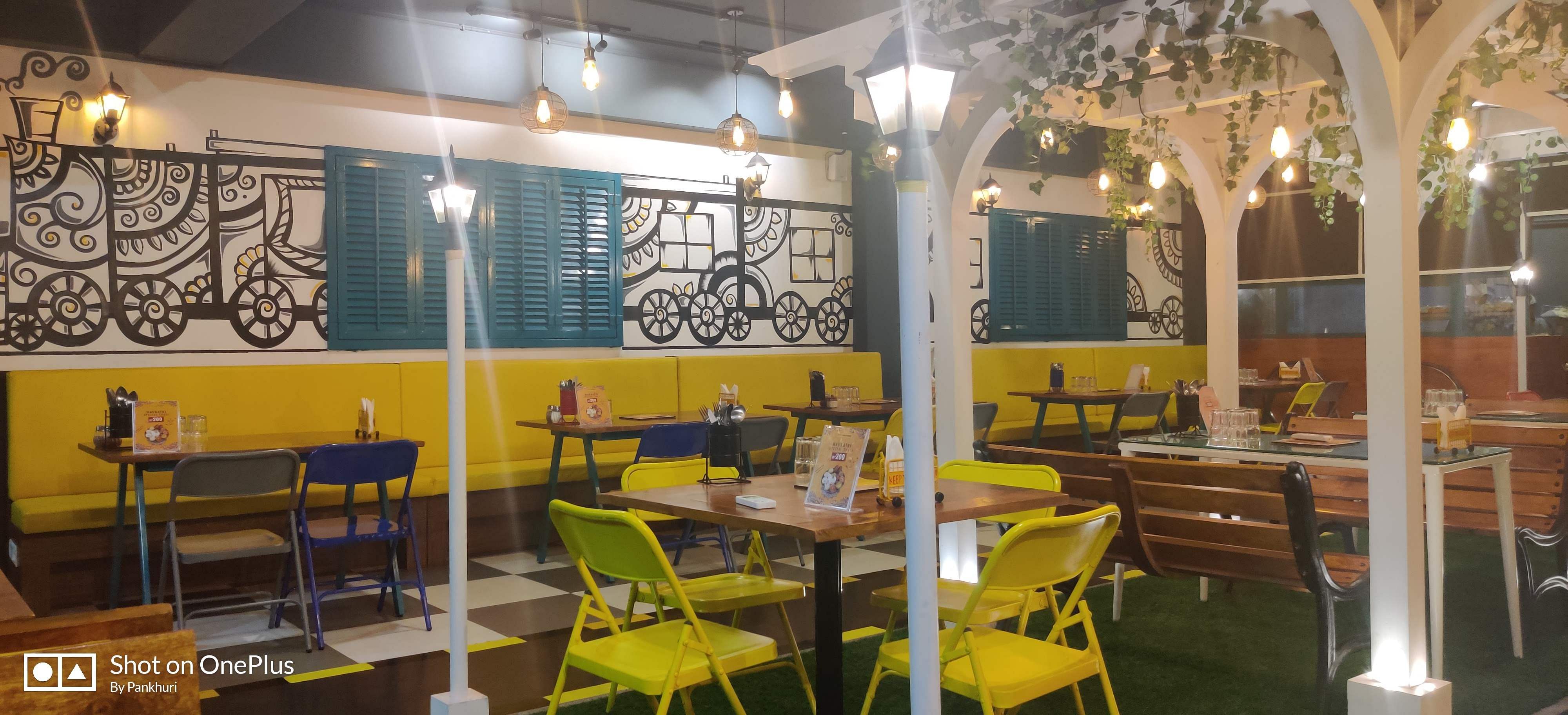 Restaurant,Room,Yellow,Interior design,Building,Table,Dining room,Furniture,Architecture,Cafeteria