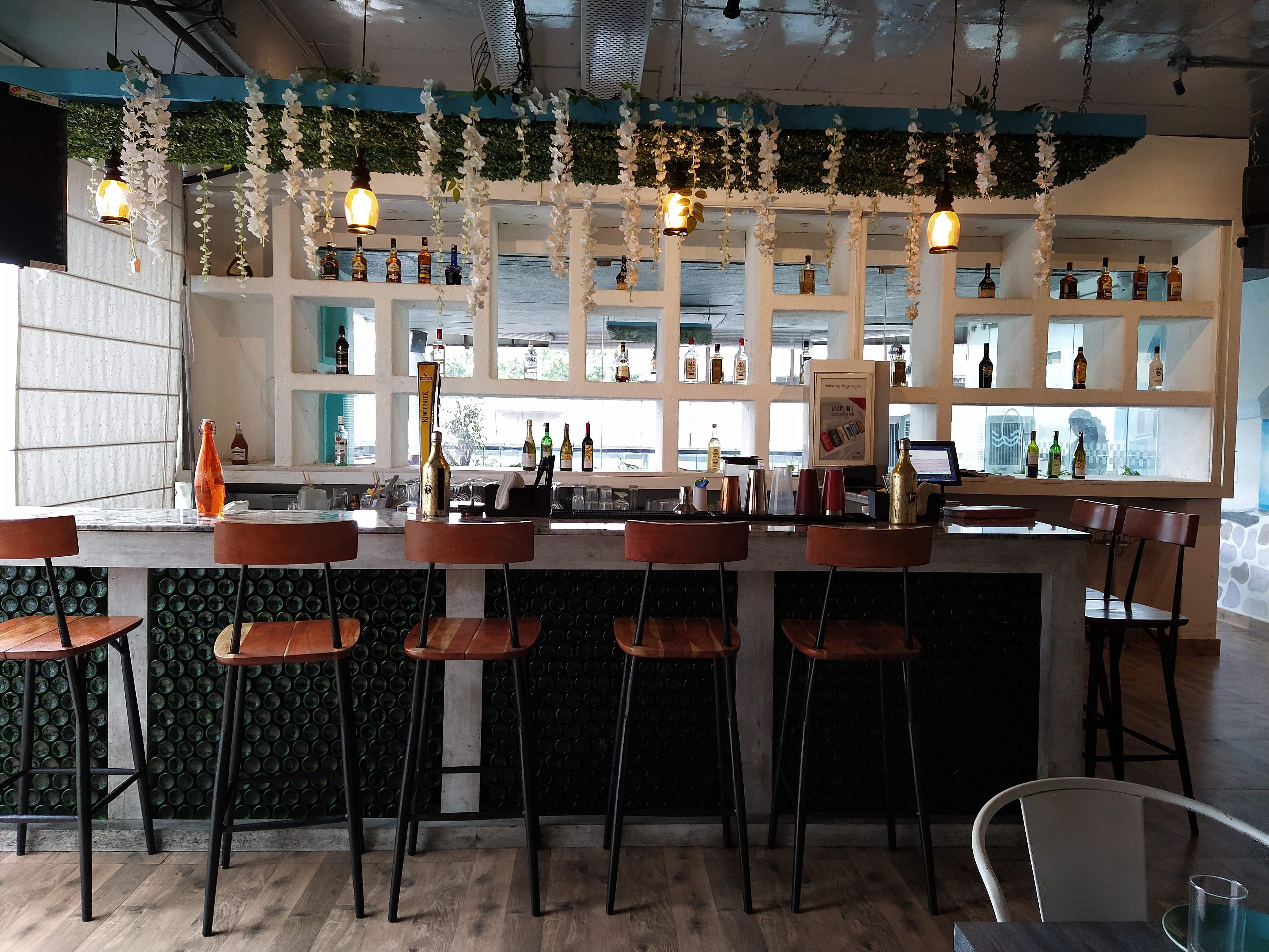Building,Restaurant,Room,Furniture,Table,Interior design,Bar,Café,Architecture,Barware